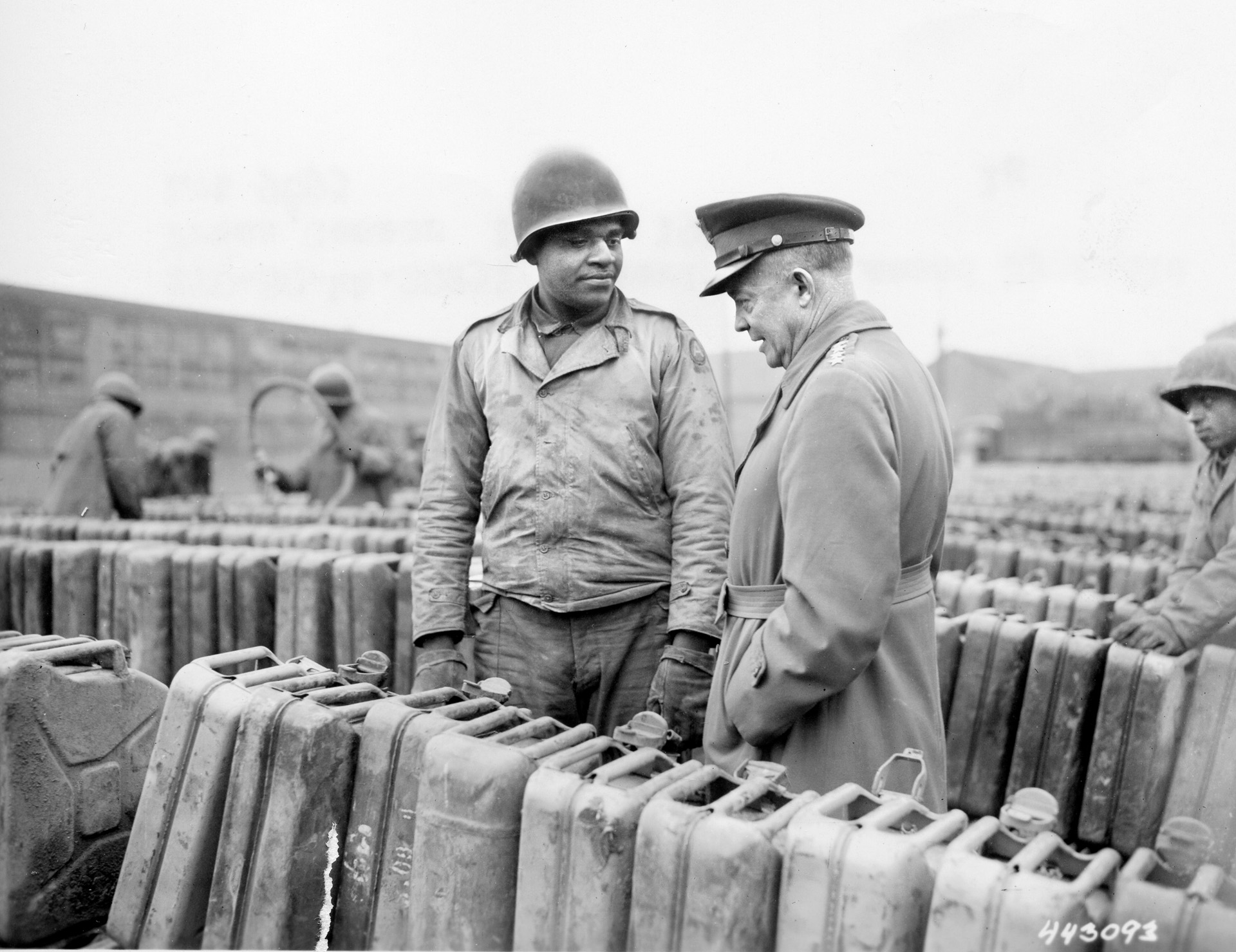 Private Edward Clay of New Iberia, Louisiana, explains the fuel situation with Eisenhower. The lack of gasoline seriously hampered all of Eisenhower’s armies as they reached the  German border.