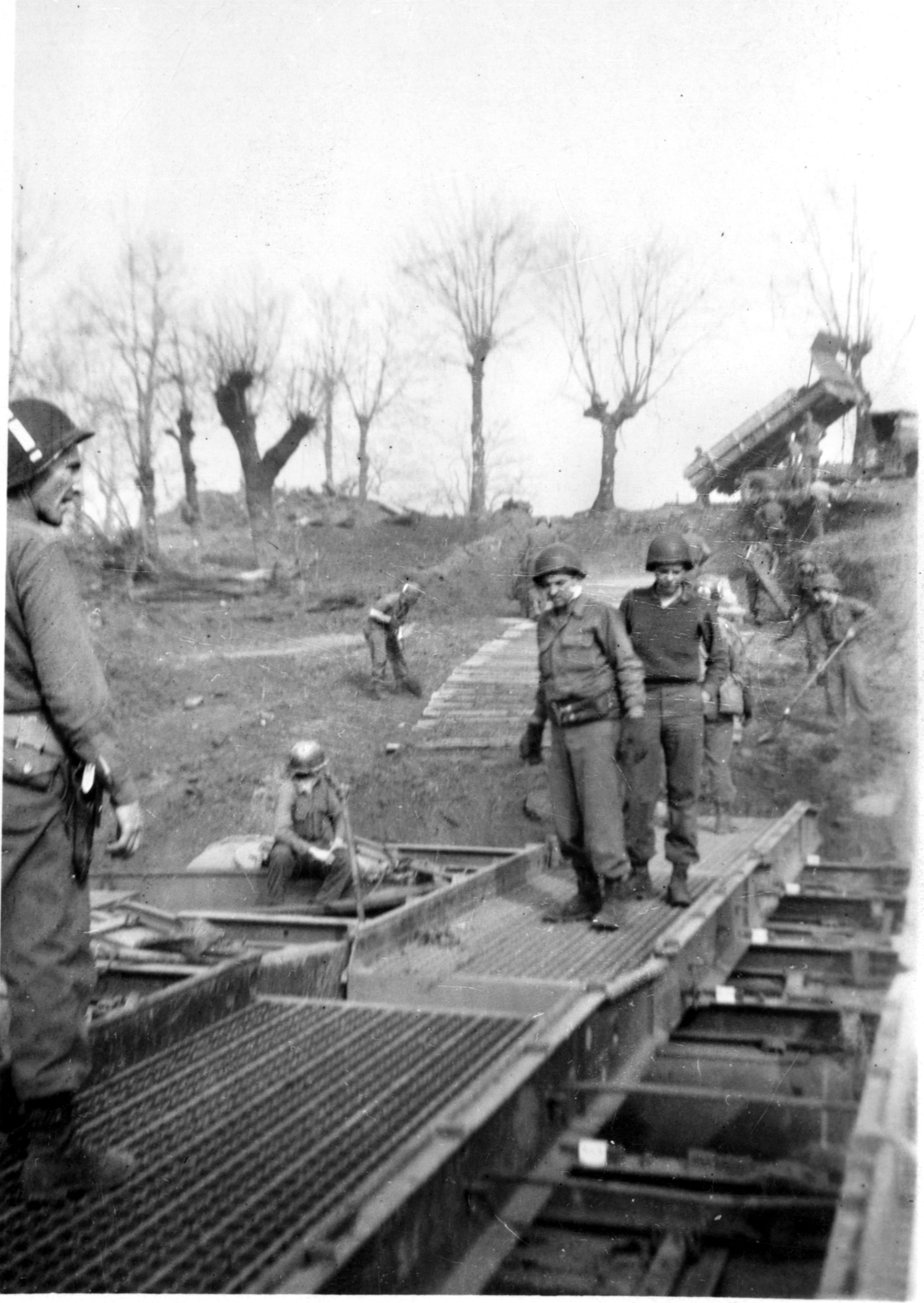 American combat engineers erect a bridge across a river in France during the Allied drive into Germany in the last year of World War II. Baker was assigned to command of Company B, 290th Combat Engineers, but he and his unit served as riflemen for several frigid weeks during fighting in the Vosges Mountains. 
