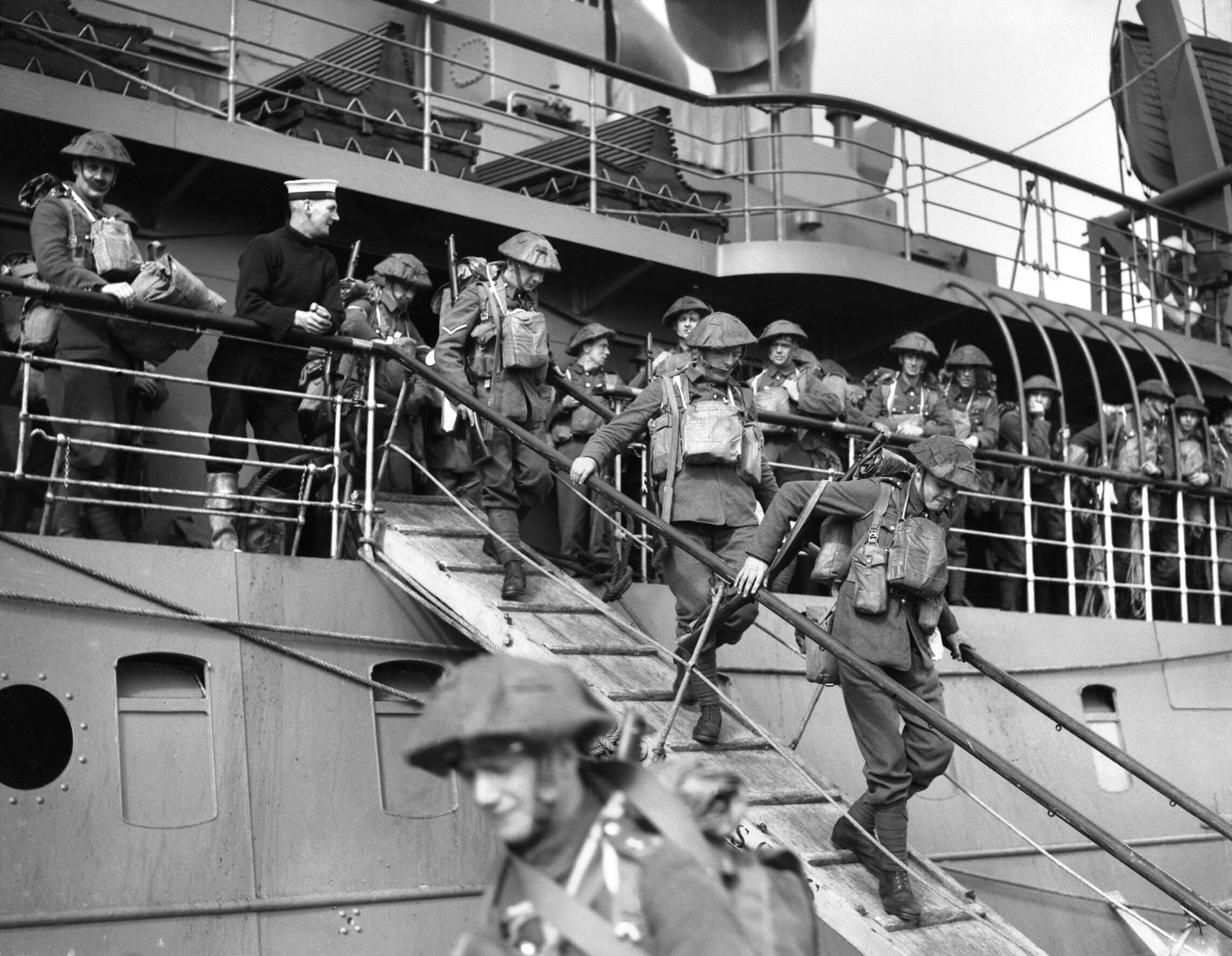 On September 16, 1939, British soldiers of the 2nd Royal Inniskilling Fusiliers disembark from the steamer Royal Sovereign at the French port of Cherbourg. 