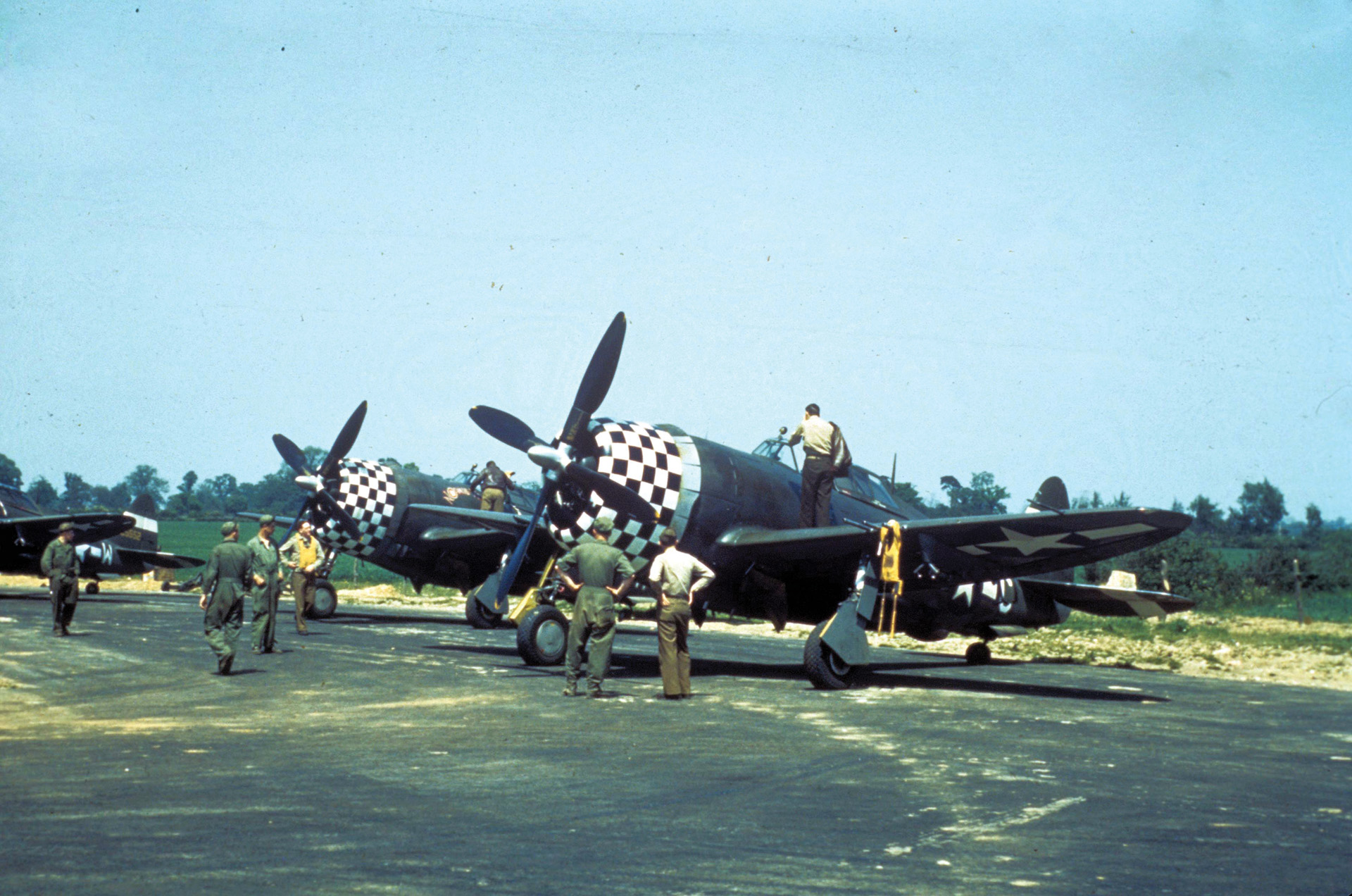 Ground crewmen prepare the P-47 Thunderbolt fighters of the 78th Fighter Group at Duxford, United Kingdom, where the group was based in 1944. 