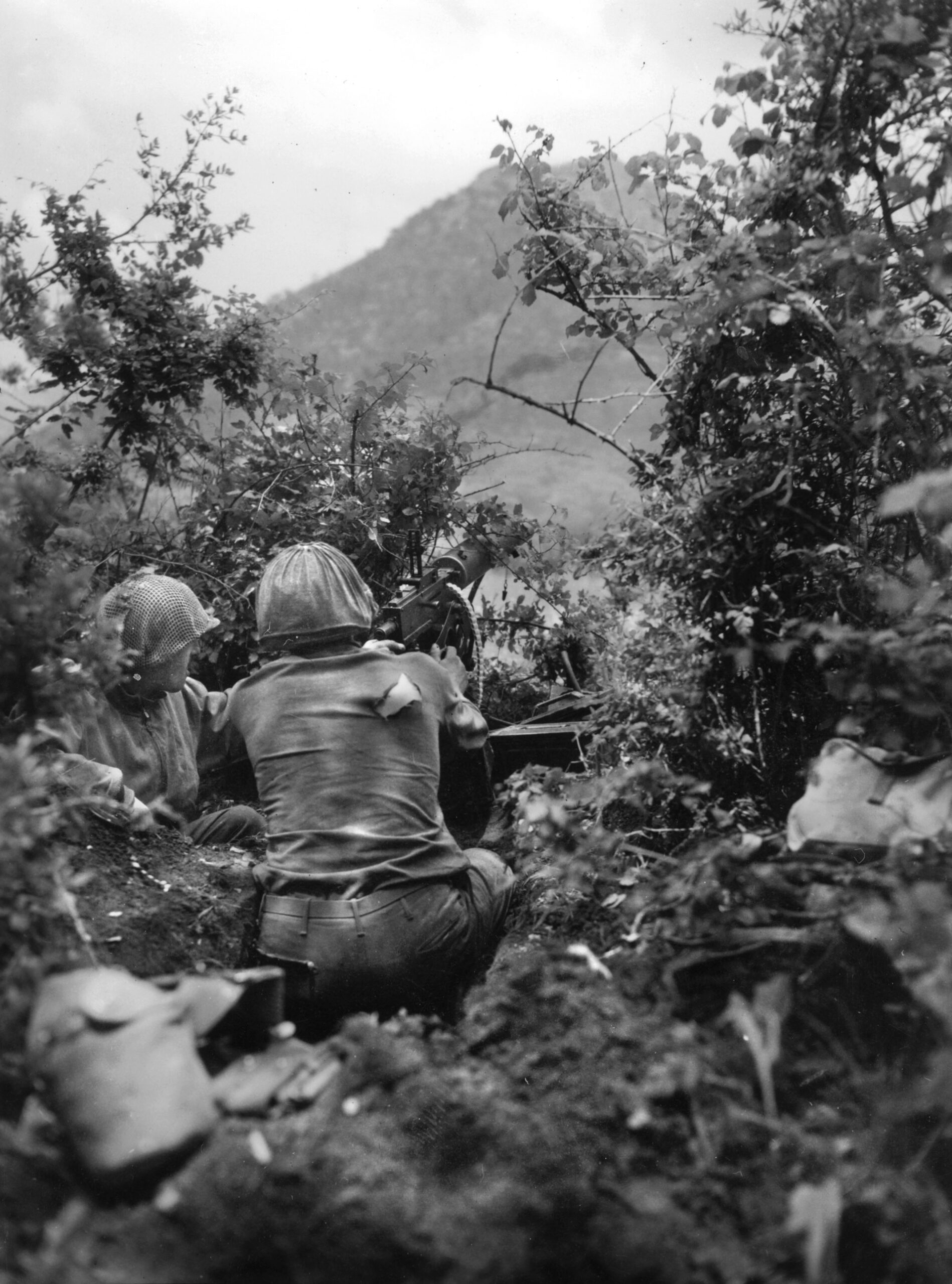 An American crew fires a .30-caliber machine gun at a German patrol spotted on a hill west of the Italian town of Fondi. This photo was taken on May 24, 1944, during the Allied Fifth Army offensive in the spring of 1944.