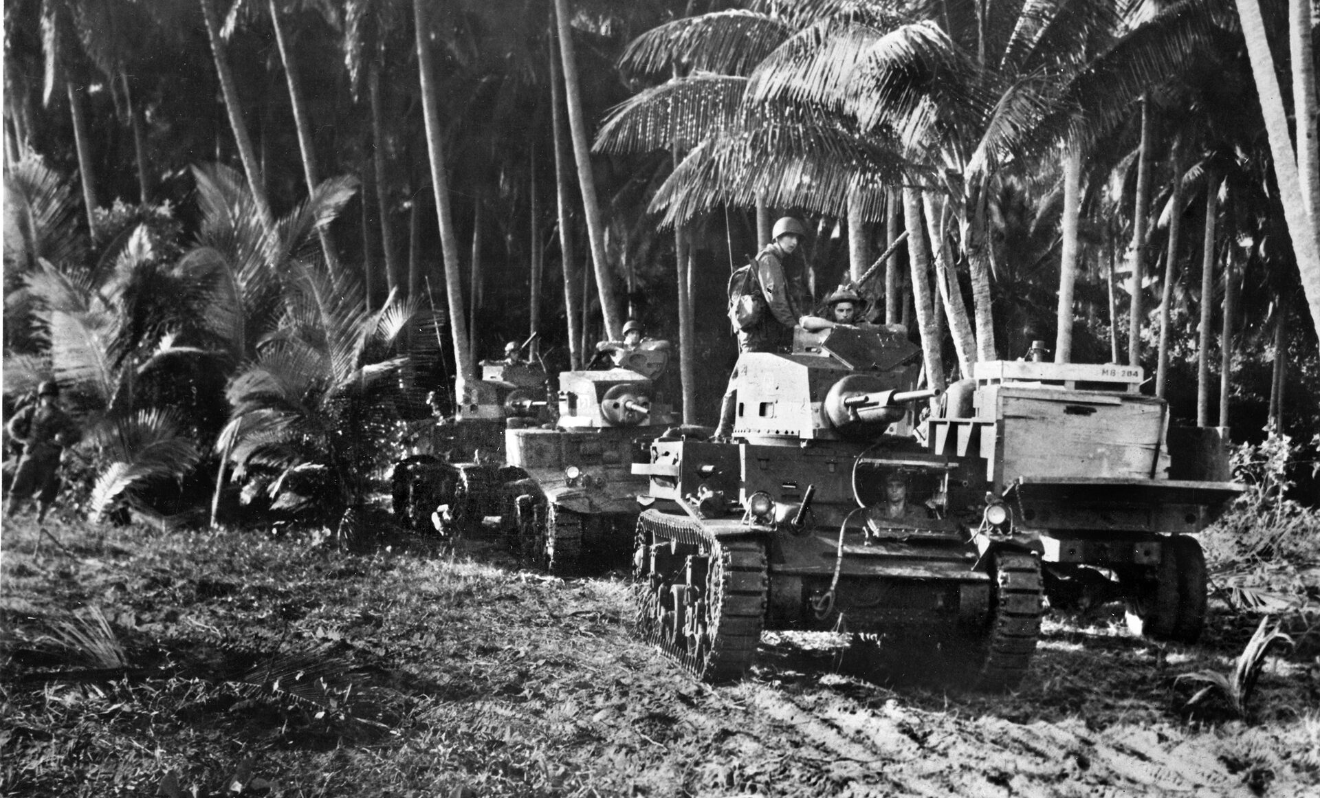 M3 Stuart light tanks move forward on Guadalcanal. Mounting a 37mm main weapon and .30-caliber machine guns, the Stuarts inflicted heavy losses on the attacking Japanese at the Battle of the Tenaru River. 