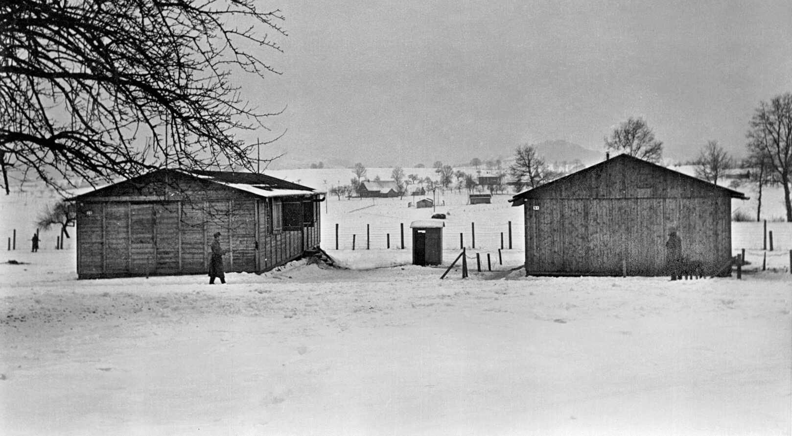 Swiss guards walk sentry duty at the prison camp at Wauwilermoos. American internees who attempted to escape or caused trouble were often imprisoned there, and the living conditions were far from comfortable. 