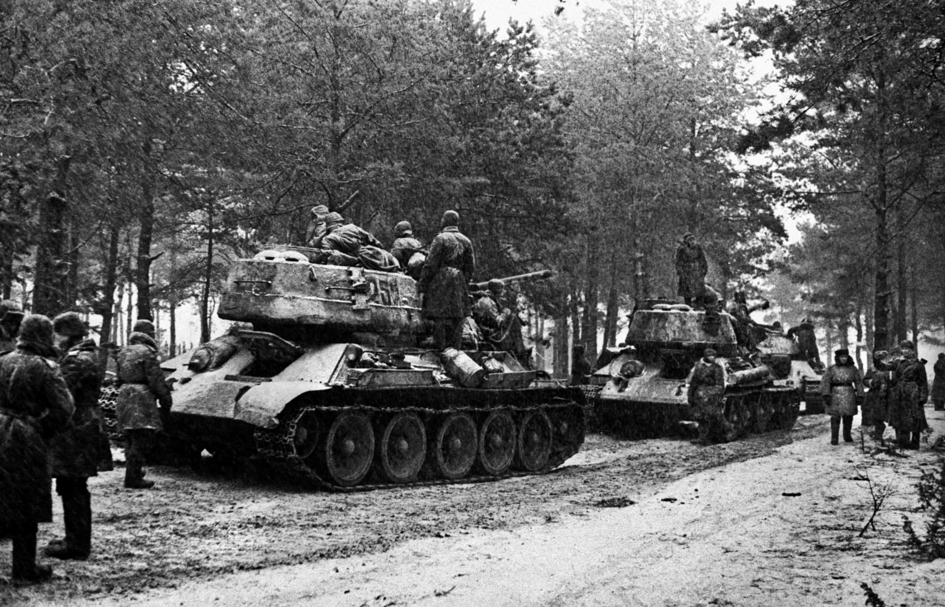 January 1945: Advancing through a wintry landscape, Red Army troops and armor approach East Prussia.