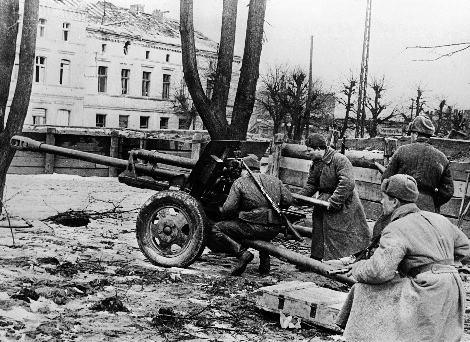 Red Army soldiers with a 76mm ZiS-3 gun prepare to fire it against buildings in downtown Danzig, March 1945.