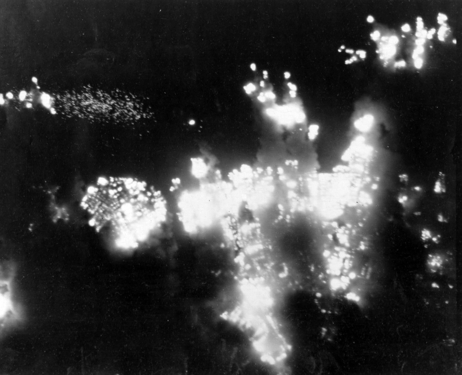 Aerial view of the flaming city of Shizouka, 85 miles southwest of Tokyo. The city was bombed 10 times during the war. On June 19, 1945, over 13,000 incendiary bombs were dropped on it, destroying nearly 27,000 homes.