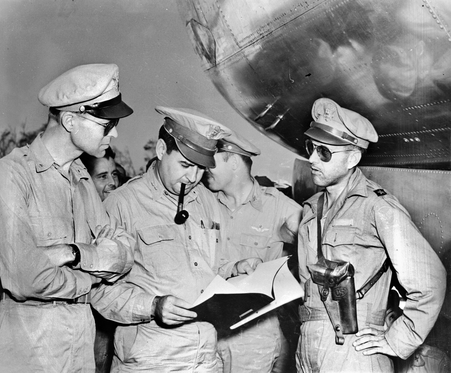 Brig. Gen. Thomas Power, right, led Operation Meetinghouse on March 9/10. Maj. Gen. Lemay, center, looks over the after-action report with Brig. Gen. Lauris Norstad, Chief of Staff, 20th Air Force. 