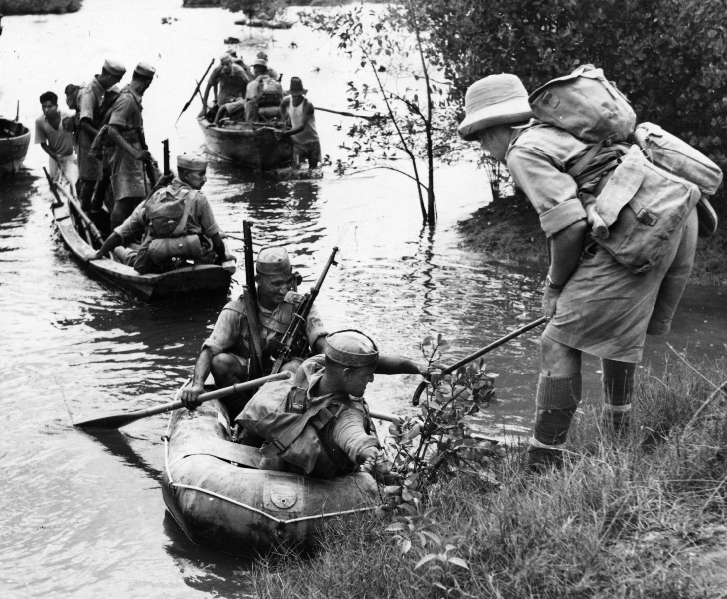 Indian soldiers cross a river during military exercises near Singapore prior to the Japanese invasion. The quality of the Commonwealth troops available to stem the Japanese tide in early 1942 was questionable, and the enemy invasion met with swift success. 