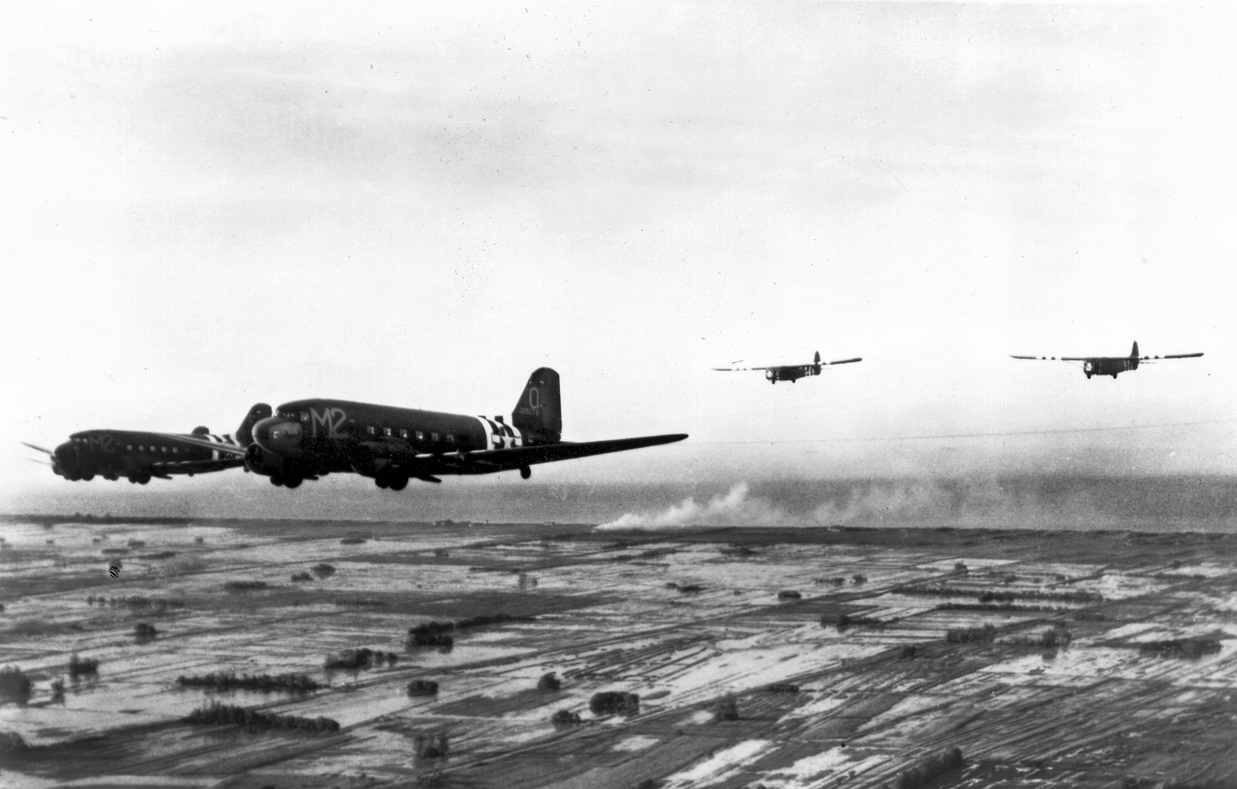 These C-47A aircraft are pictured towing gliders in the skies above Normandy in June 1944. The C-47 was widely used for this purpose and to deliver paratroopers during airborne operations in Europe and the Pacific.