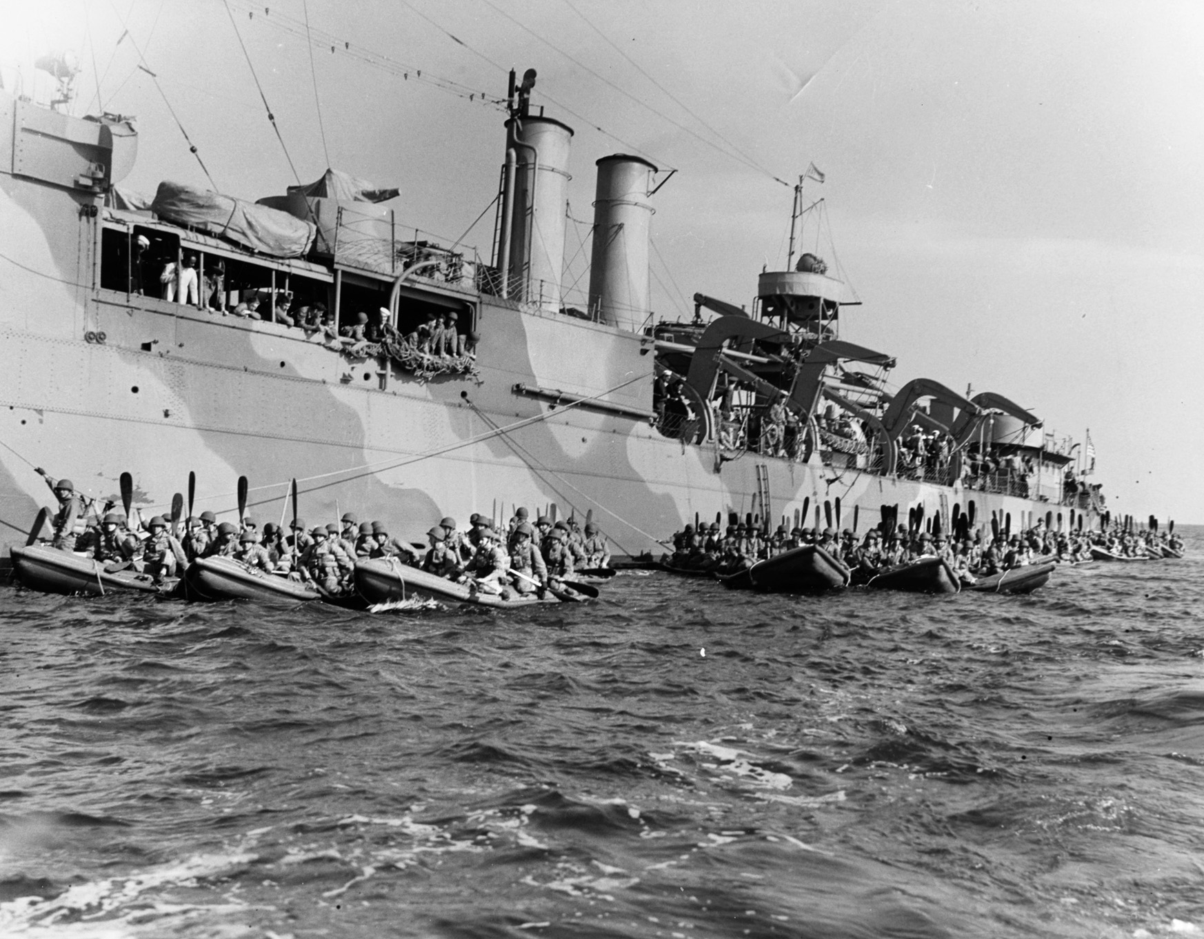 Carlson's Raiders pull away from a fast transport (APD) during training for the Makin Raid in early 1942. This exercise was to gain proficiency in the use of small rubber boats. However, heavy seas swamped several of the craft during the run-in from the submarines to the beach at Makin.