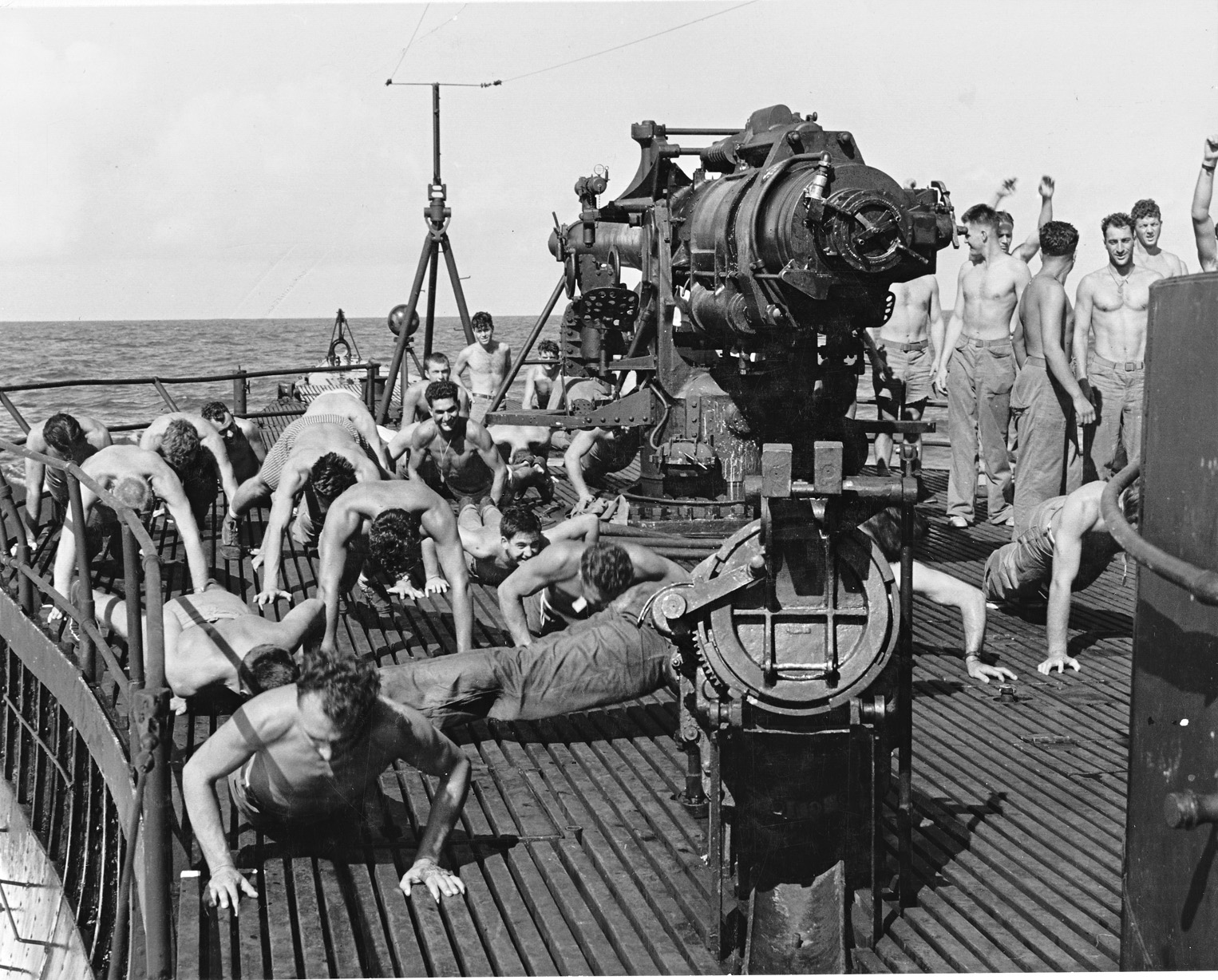 Staying in shape during their voyage to Makin, a group of Carlson’s Raiders does calisthenics aboard the submarine USS Nautilus. The raid resulted in the gathering of some intelligence and the inflicting of serious casualties on the Japanese, but 19 Marines were killed in action. 