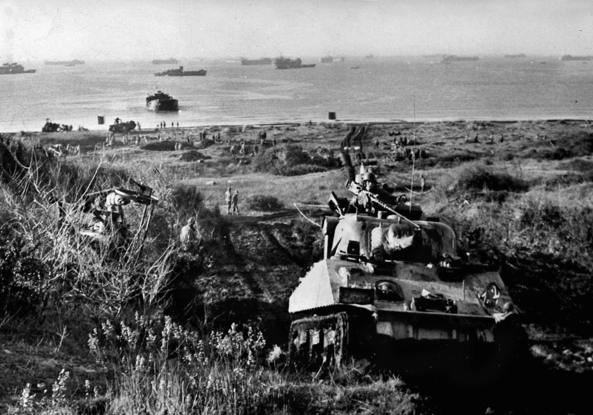 An American tank rolls forward to the crest of a hill just off the beach at Anzio. When the Germans realized that Rome was threatened, they reacted swiftly and hemmed in the VI Corps on the beach. The result was a months-long, bloody stalemate.