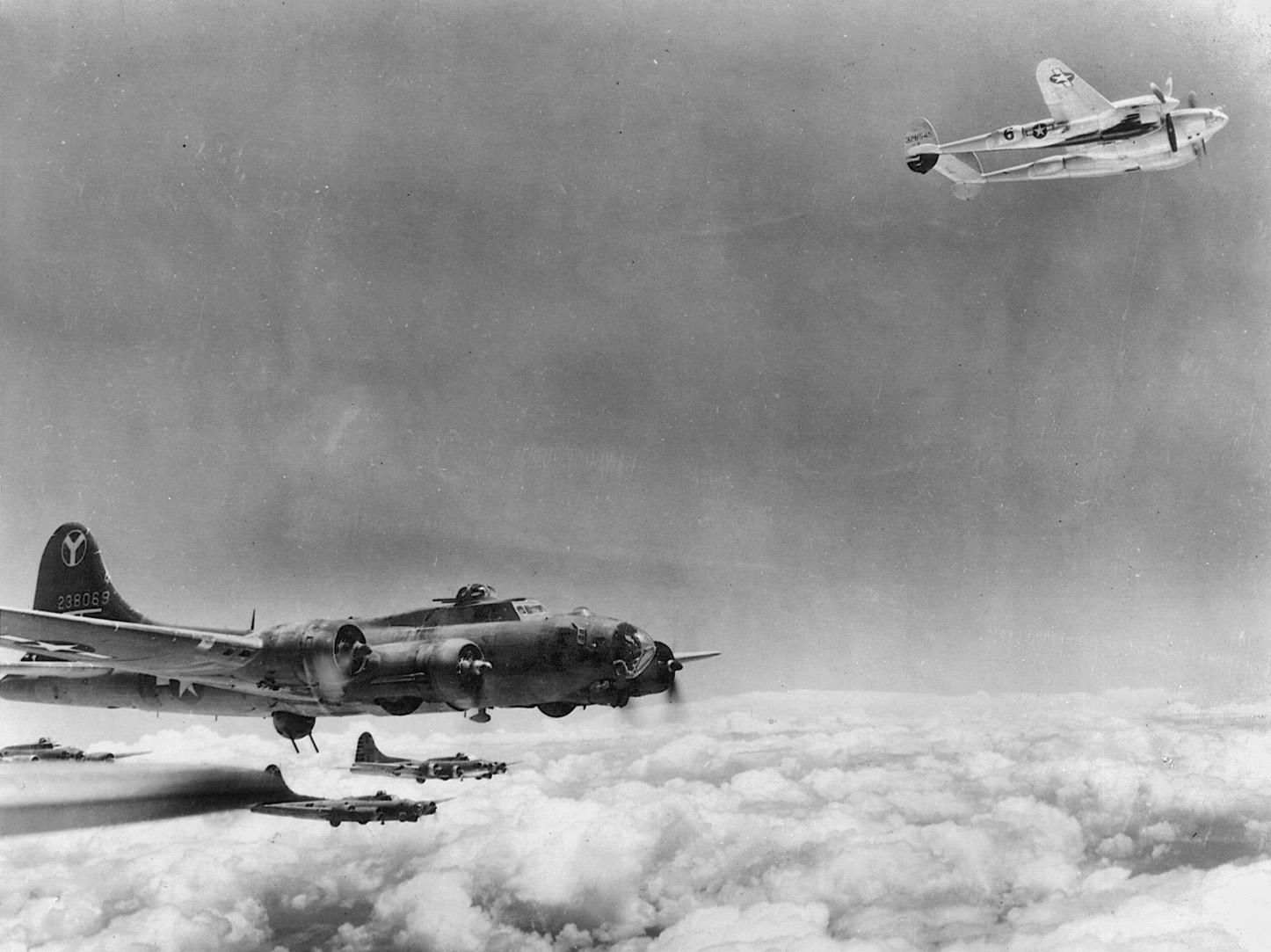 The Lockheed P-38 Lightning fighter, upper right, was a robust twin-boom and twin-engine aircraft that was capable of flying bomber escort missions and engaging in air-to-air combat. The Germans nicknamed the Lightning the “Fork-tailed Devil.”