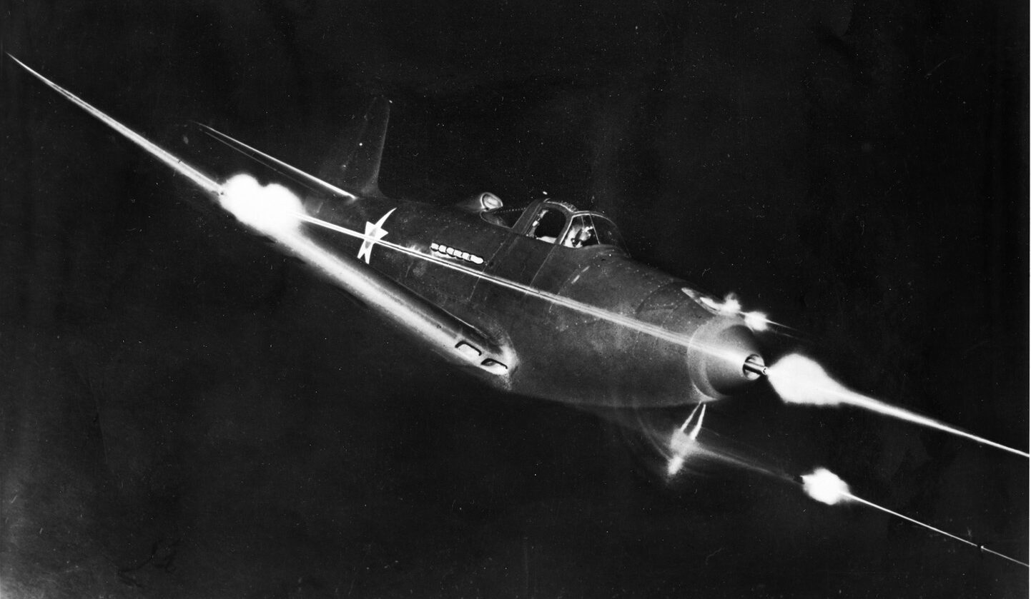 A Bell P-39 Airacobra fighter fires its guns during a nocturnal demonstration flight. Although the P-39 was a disappointment as a dogfighter, the aircraft was adept at ground attack and provided excellent ground support to Allied troops in the Pacific.