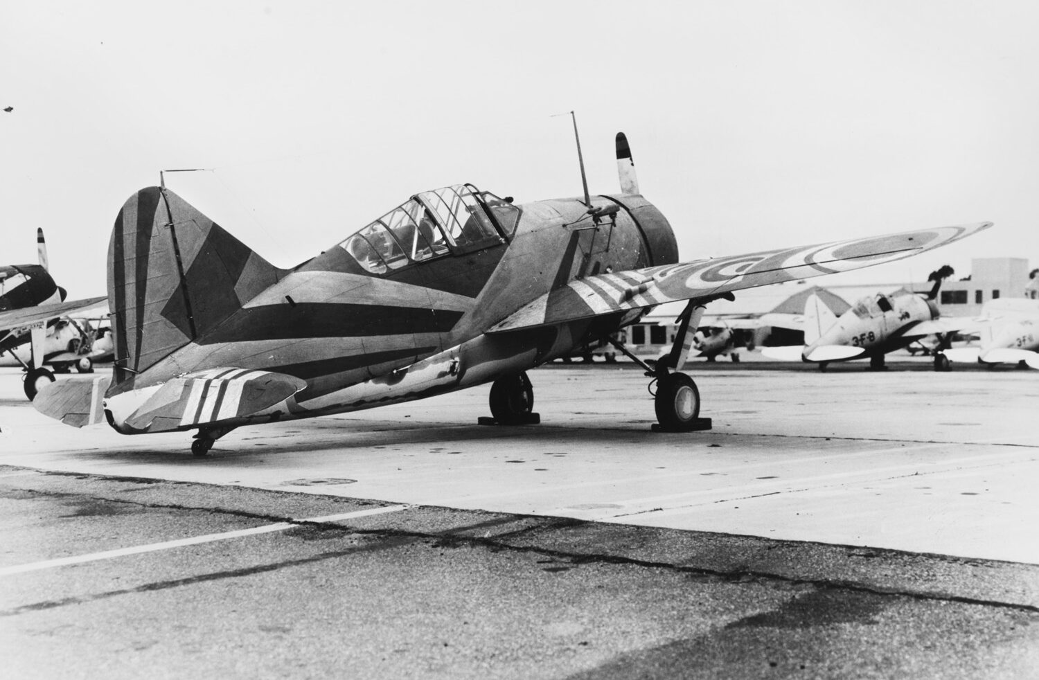 A Brewster F2A-1 fighter painted with experimental dazzle camouflage designed by McClelland Barclay. Dazzle camouflage on warplanes did not work as well as it did on ships. 