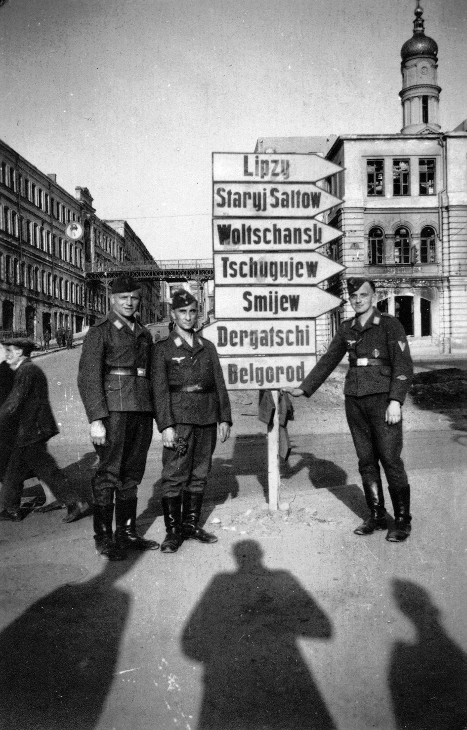Three Luftwaffe soldiers pose in Belgorod in front of one of many large directional signs that were commonplace in Russian cities. The city was recaptured by Soviet forces in August 1943, losing some 50,000 troops, while Germany lost some 20,000 men including 6,000 Hitler Youth. 