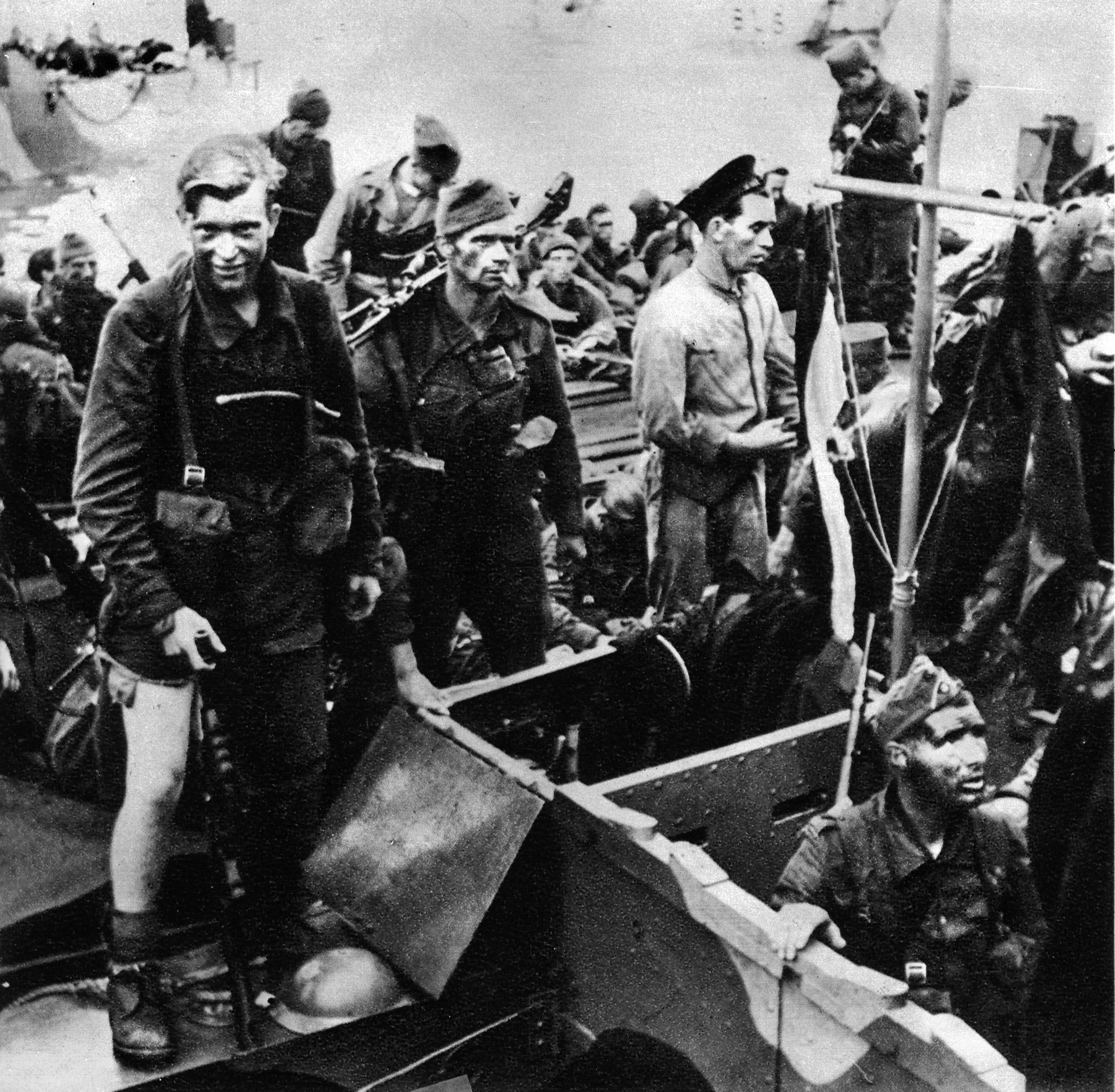 British Commandos, survivors of the disastrous Dieppe raid and looking the worse for wear, gather aboard boats taking them back to Britain, August 1942. 