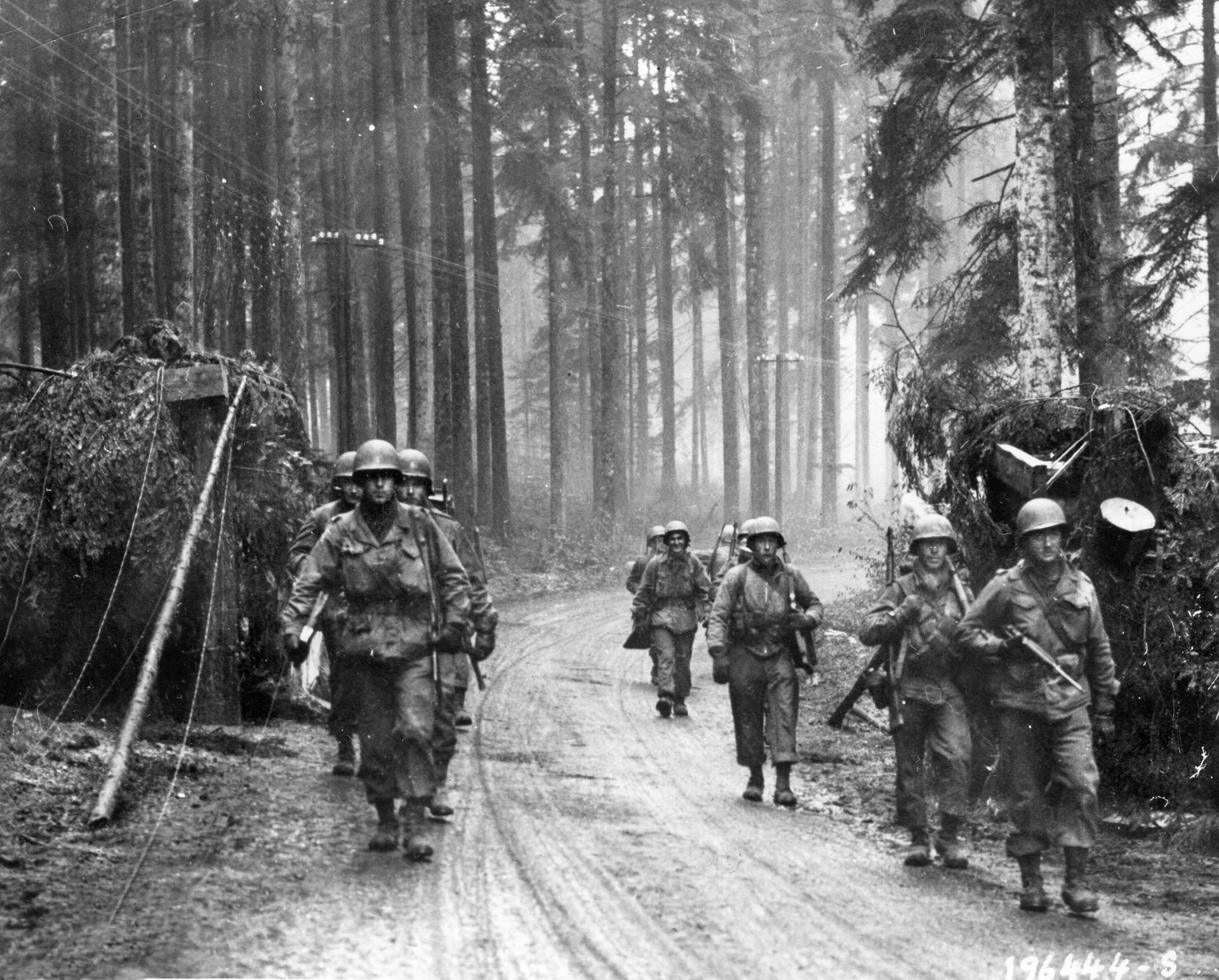 Century Division men pass through a demolished German roadblock during the Seventh Army’s advance, November 19, 1944—successfully cracking the Germans’ Winter Line in the Vosges Mountains. 
