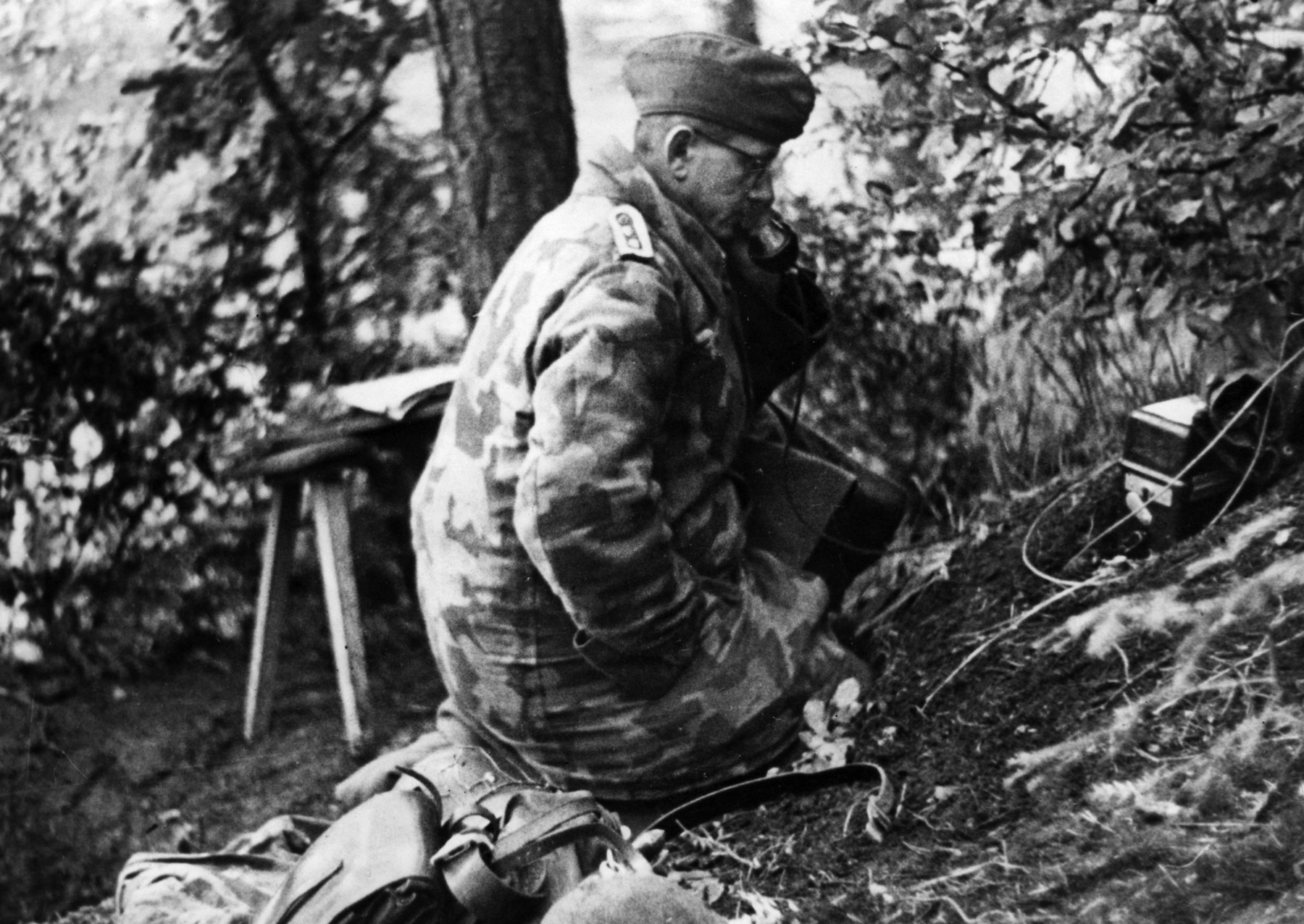 A German artillery observer in the Vosges Mountains calls in a fire mission to his battery. The 88mm guns of the Luftwaffe were used not only for air and antitank defense, but also as conventional artillery.