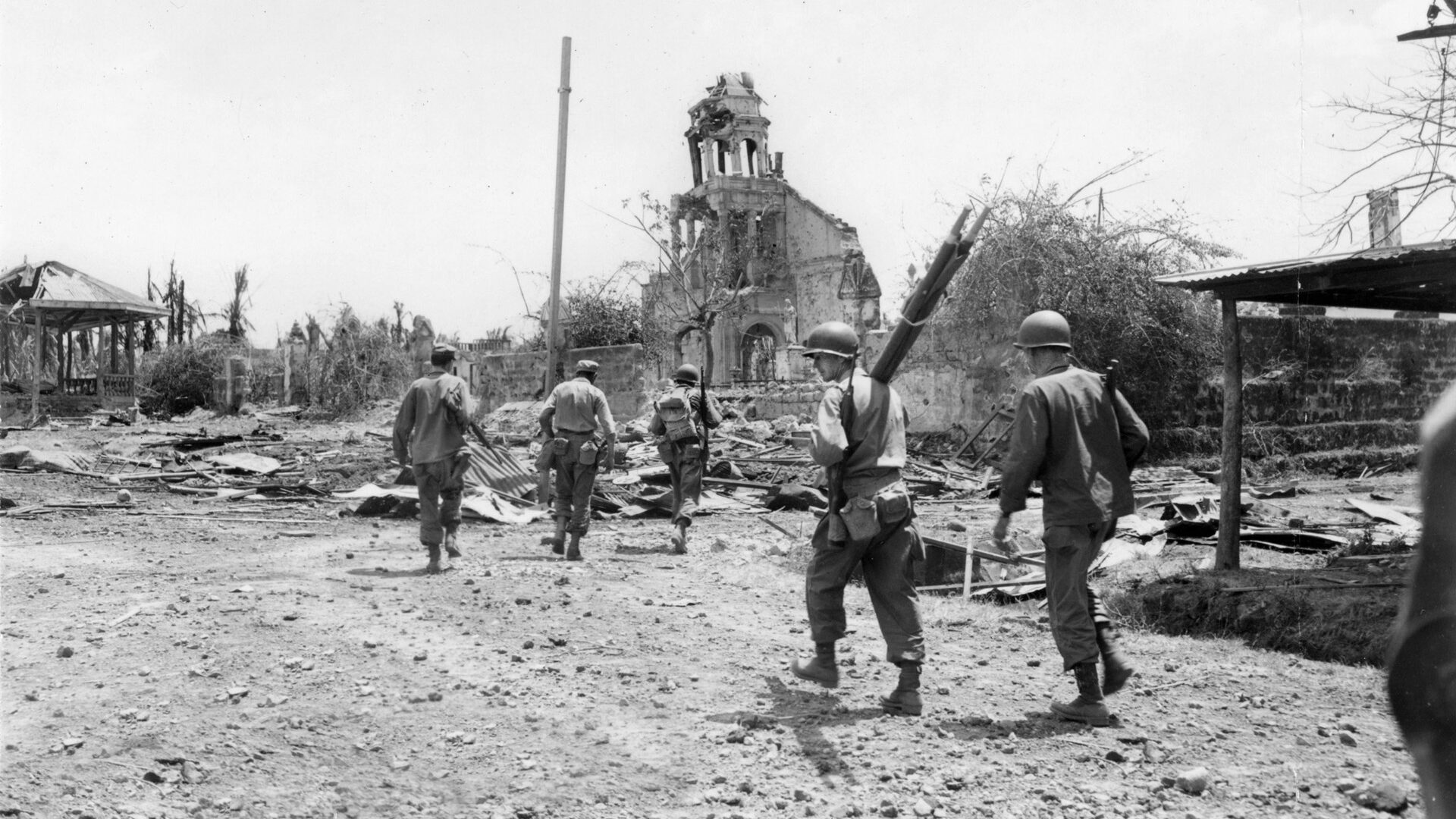 American troops enter the grounds of Santo Tomas University to secure the area and liberate the internees. Some straggling Japanese soldiers were rounded up as the liberation concluded. 