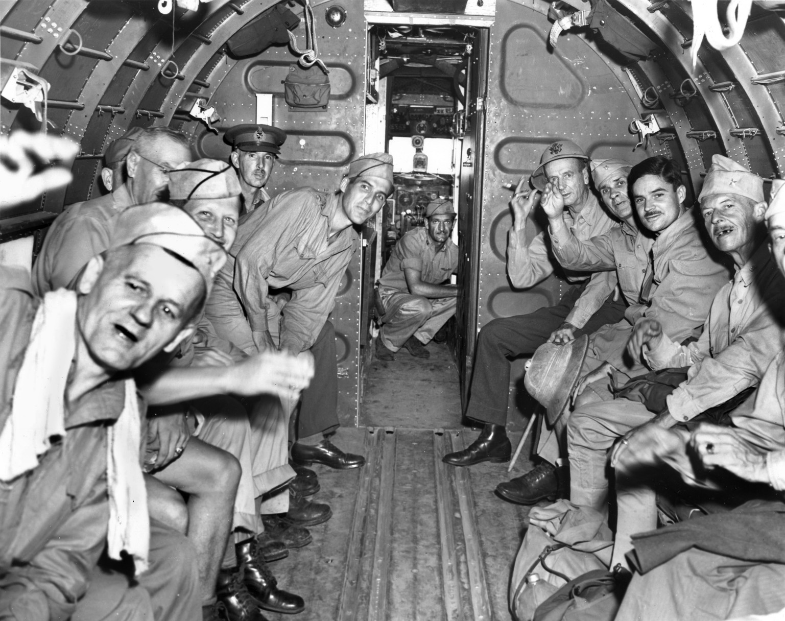 Their ordeal at last over, freed prisoners prepare to fly out of Mukden. British General Arthur Percival sits rear left, Wainright, rear right. 