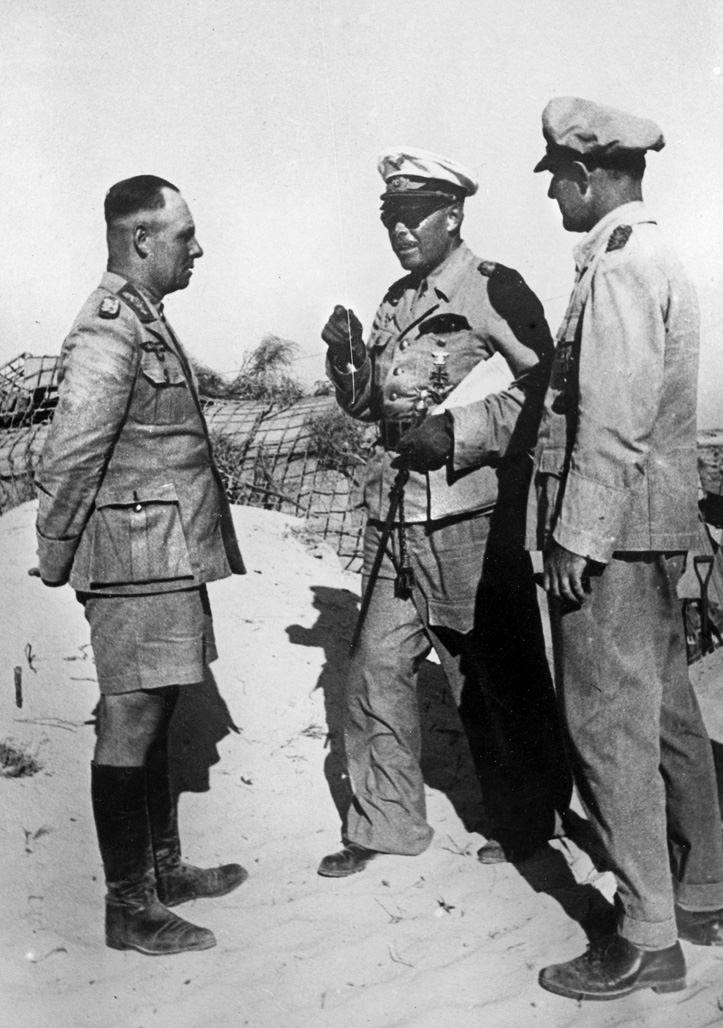  Albert Kesselring (center) and Erwin Rommel (left), both senior German field commanders, confer during a meeting at El Alamein in North Africa in August 1942.