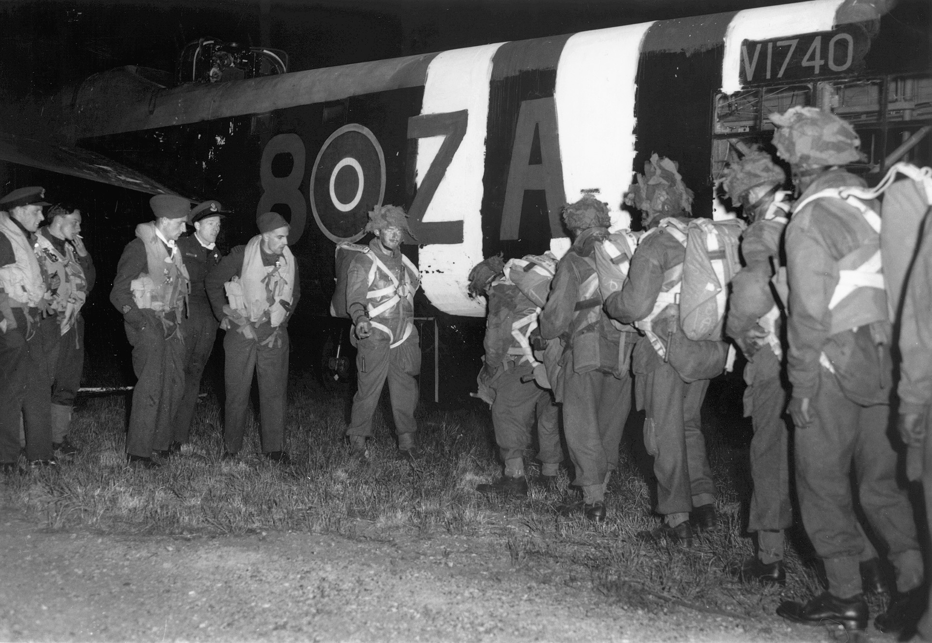 Next stop: Normandy. Members of the British 6th Parachute Division unit load into the belly of an Albemarle troop transport that will drop them into France.