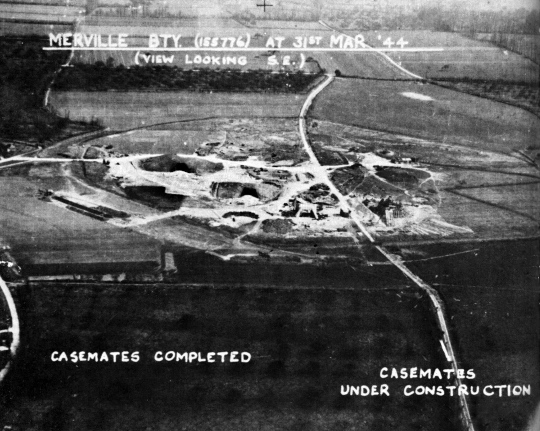 British reconnaissance photo taken in March 1944 of the Merville Battery under construction near Sword Beach, Normandy. Two casemates on the left are completed, the two on right still being built. 