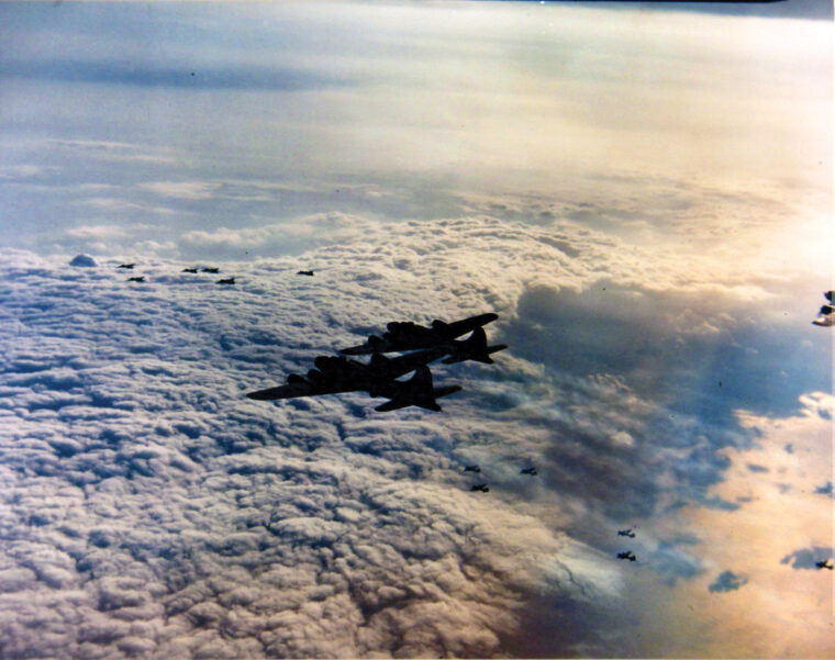 In this photo take on August 31, 1943, B-17s of the 91st Bomb Group, Eighth Air Force, approach their target—the Dornier aircraft assembly plant at Meulan, France. After experiencing heavy losses in raids on targets inside Germany earlier in the year, General Ira Eaker ordered later attacks to be made in France, within the limited range of escorting fighters.