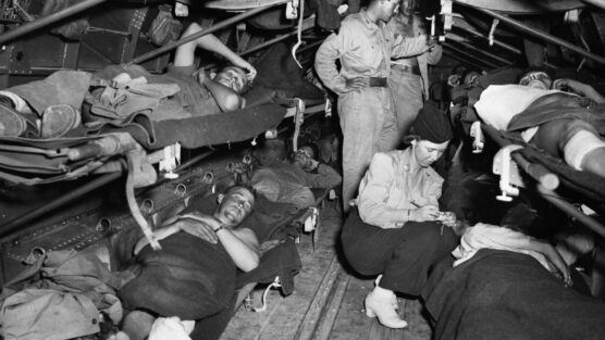 In July 1943, Lieutenant Katye Swope, a nurse with the 802nd Medical Air Evacuation Transport Squadron, prepares patients for a flight from Agrigento, Sicily, to Britain for further medical treatment. Allied air evacuation operations began during the campaign in North Africa in February 1943 and continued for the duration of World War II in every theater.
