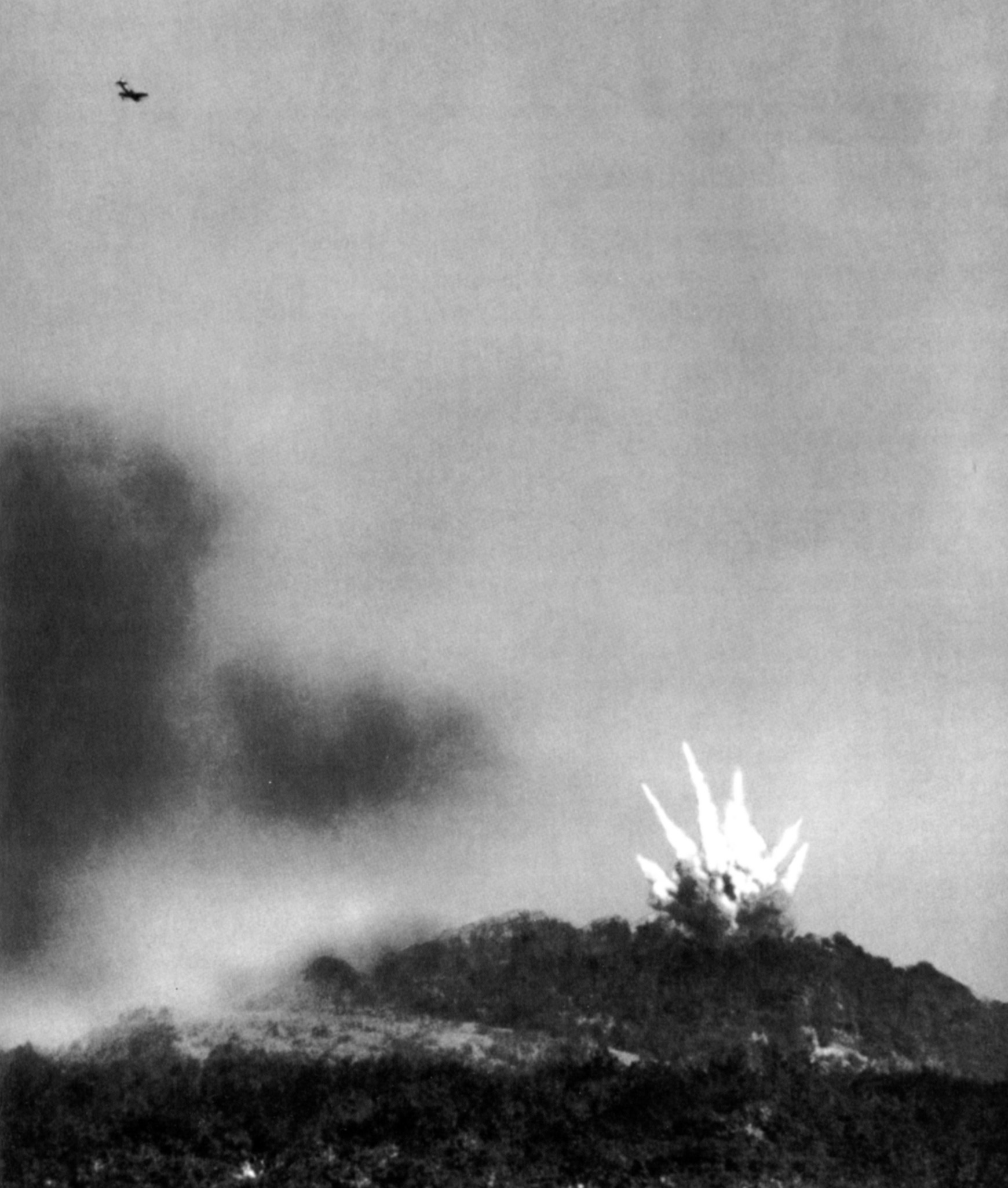 An American P-47 Thunderbolt (upper left) comes in for a dive-bombing run against the fort’s defenders at the start of the operation. Patton was disappointed with the results of aerial bombing.