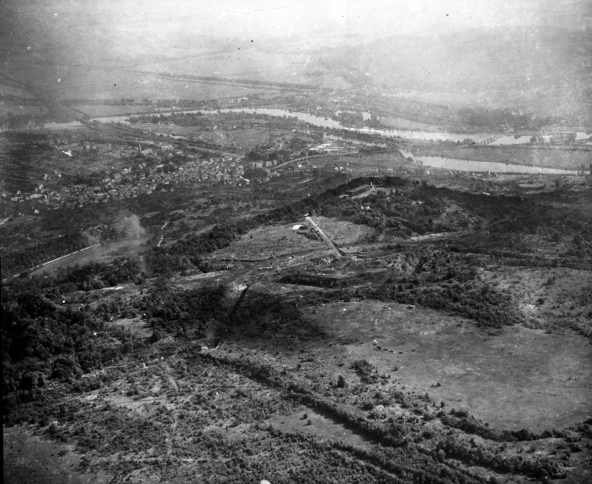 German-held Fort Driant, built in 1902 and located five miles southwest of Metz, France, was a strategic nemesis impeding Patton’s drive into Germany in late 1944. Perched high on a hill, and with a 300-man garrison, the fort was well sited to prevent crossings of the nearby Moselle River, visible in the background. 