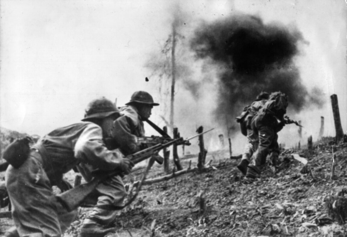 North Vietnamese ground troops break through the perimeter of a ranger firebase during Lam Son 719. The communist attackers were supported by Soviet-built PT-76 and T-54 tanks.