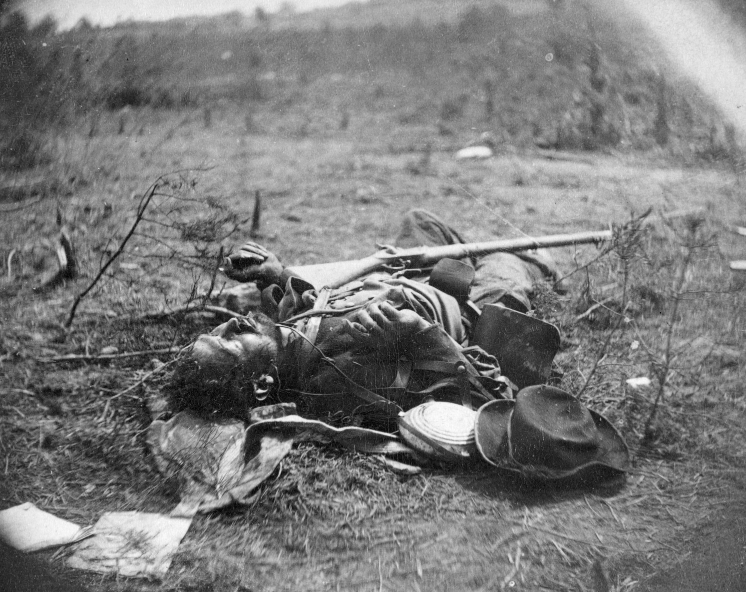 The Battle of Spotsylvania Court House saw some of the most brutal and desperate fighting of the war. The harvest of death was terrible, as shown by this photograph of a lifeless Confederate soldier behind a breastwork at the Widow Alsop Farm.