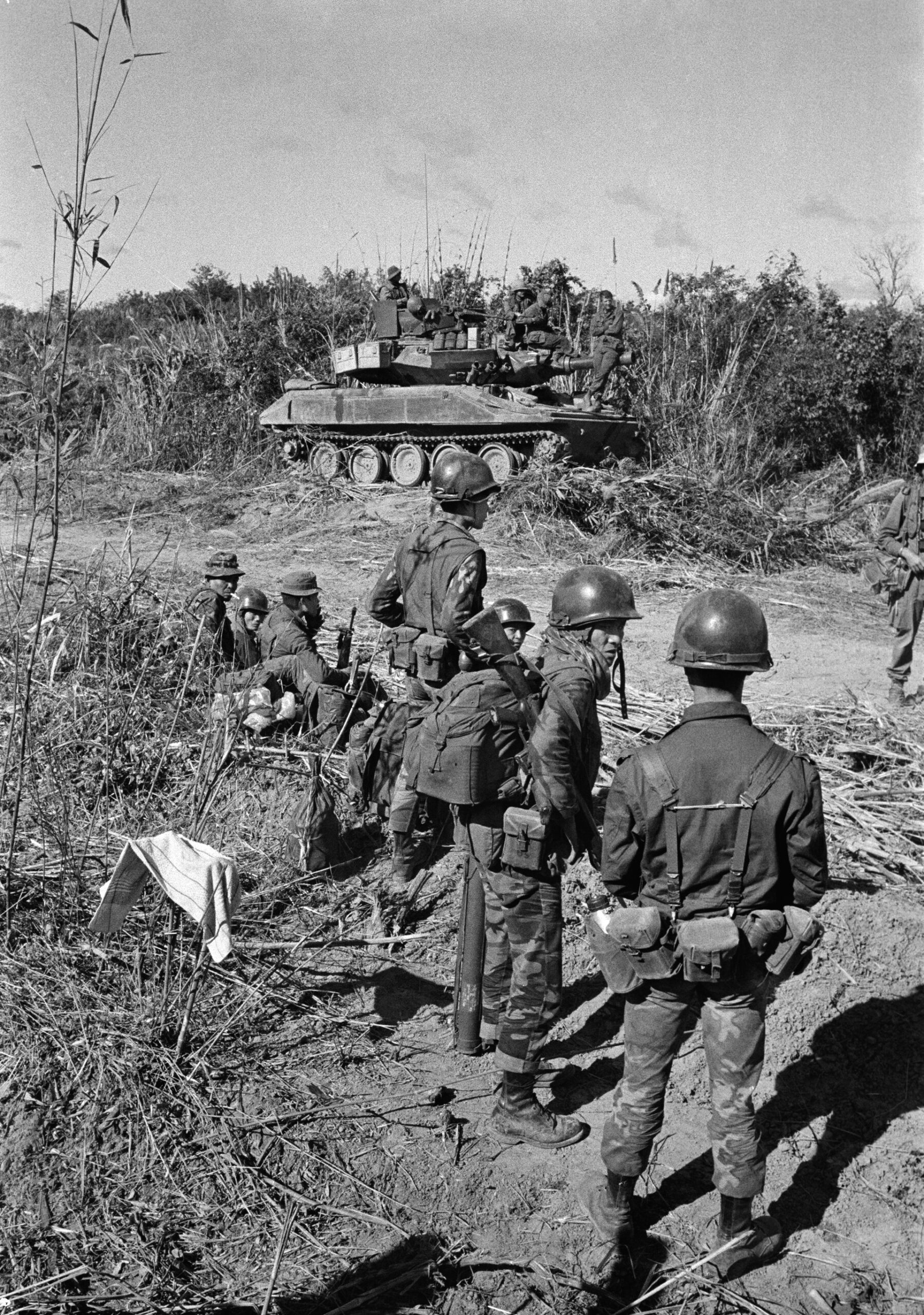 A U.S. tank covers South Vietnamese troops as they prepare to enter Laos in early February 1971. The ambitious raid was conceived partly as a test of how the South Vietnamese would fare in a ground operation without American advisers.