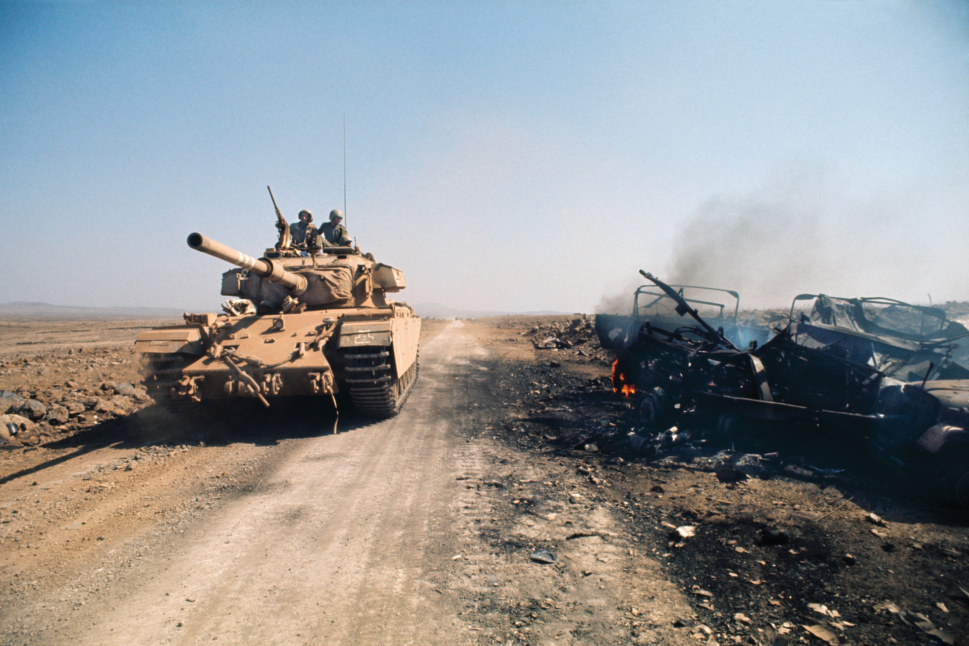 An Israeli tank passes scorched enemy vehicles during the 1973 Arab-Israeli War. Egypt deployed large numbers of missile-armed infantry in the Sinai that inflicted substantial losses on Israeli armor in the opening stage of the conflict.