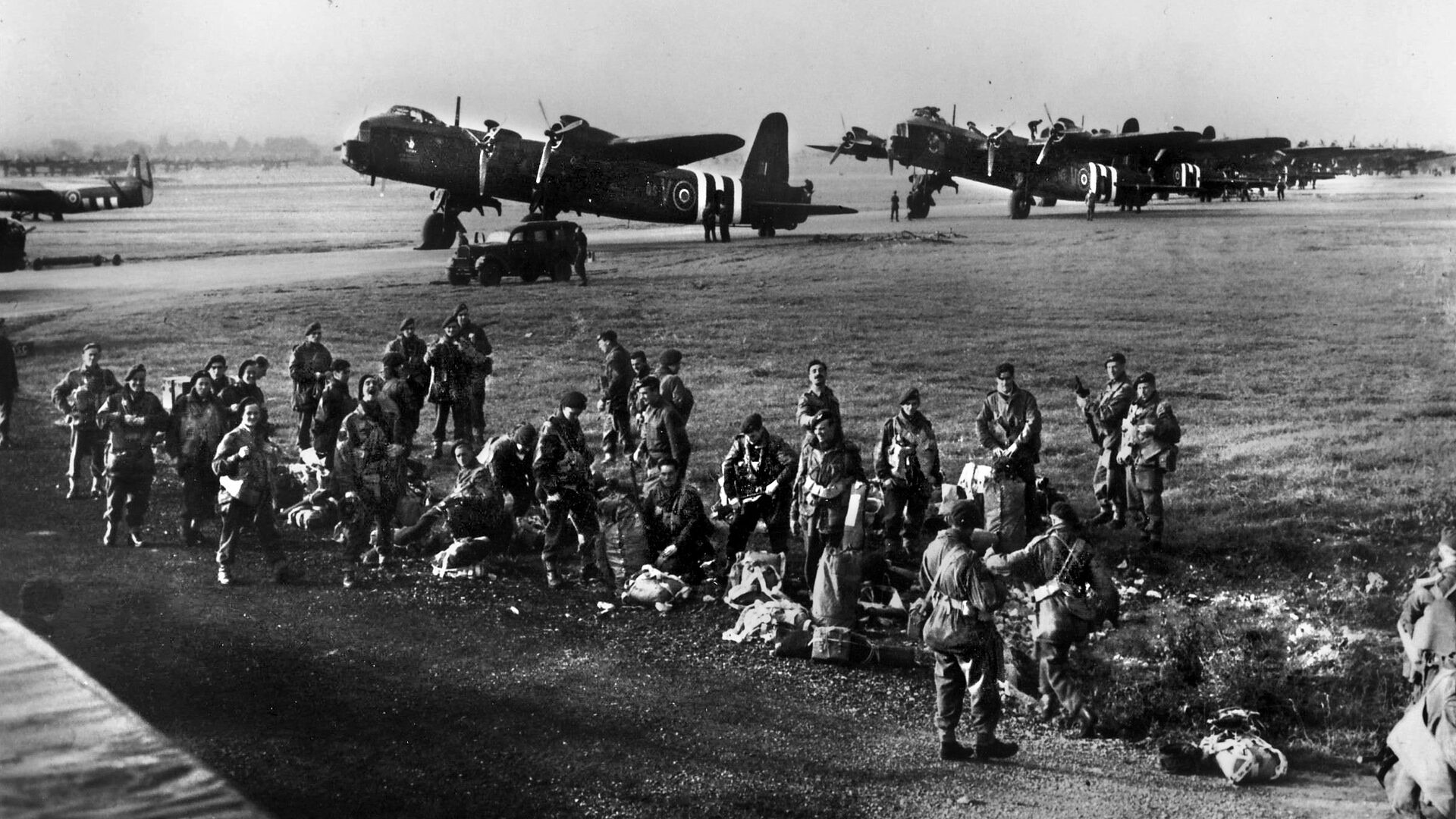 Men of 3rd Platoon, 21st Independent Parachute Company prepare to board their planes in Gloucestershire, England. American C-47 Dakotas and British Horsa Gliders transported the British and American airborne troops to their respective drop sites. 