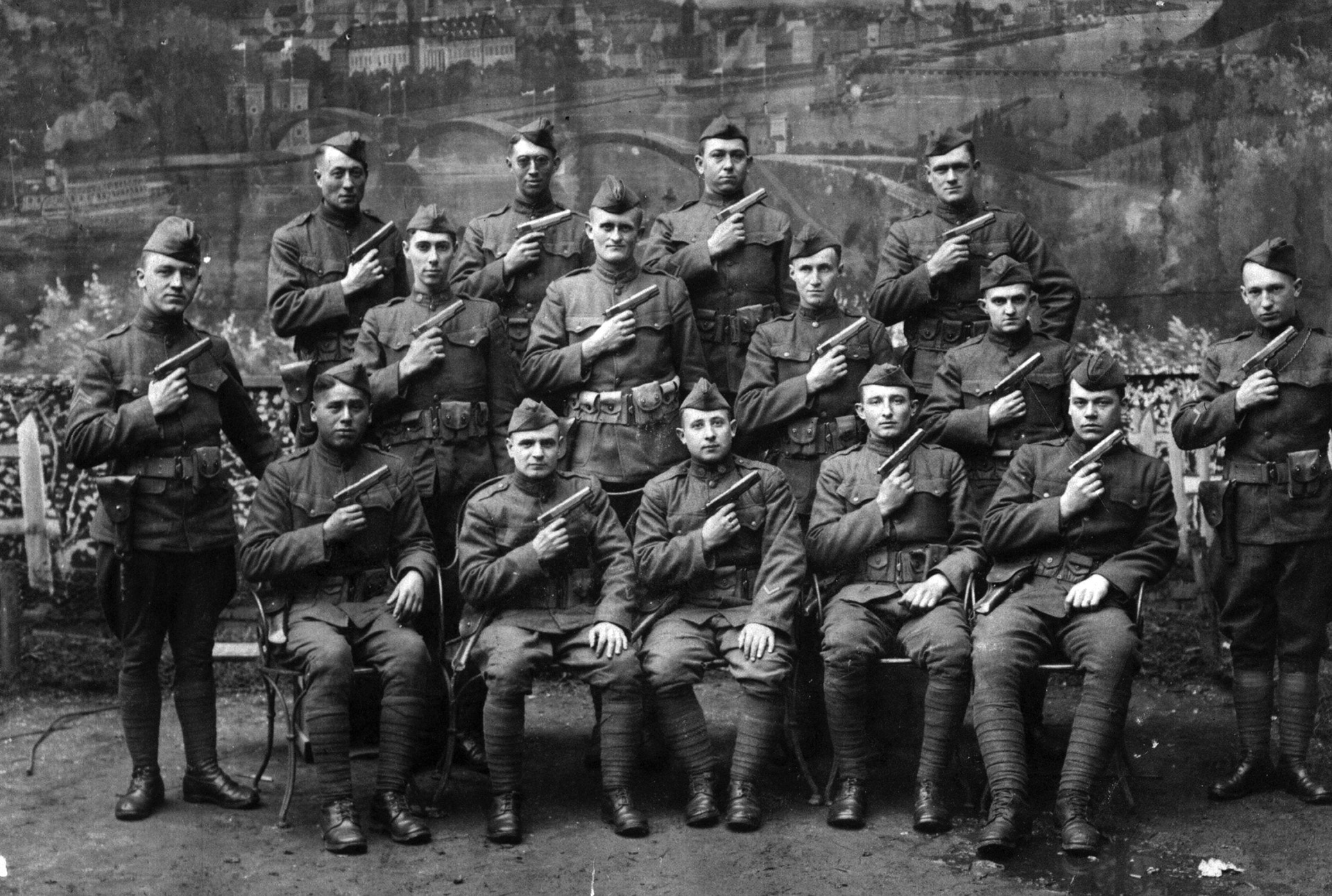 U.S. Army soldiers proudly display their Colt M1911 pistols as they prepare to go into action in France in 1917. 