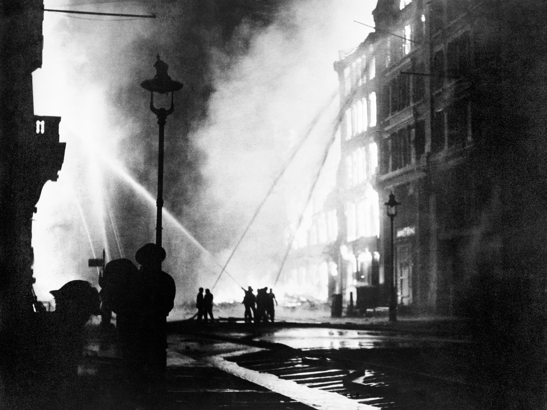 Firefighters of the London Fire Brigade bravely battle a conflagration on Queen Victoria Street with water hoses during the devastating Nazi air raid on the capital city on May 10, 1941. The raid lasted for six hours and killed 1,486 people while destroying an estimated 11,000 homes and damaging both houses of Parliament, the British Museum, and St. James Palace. 