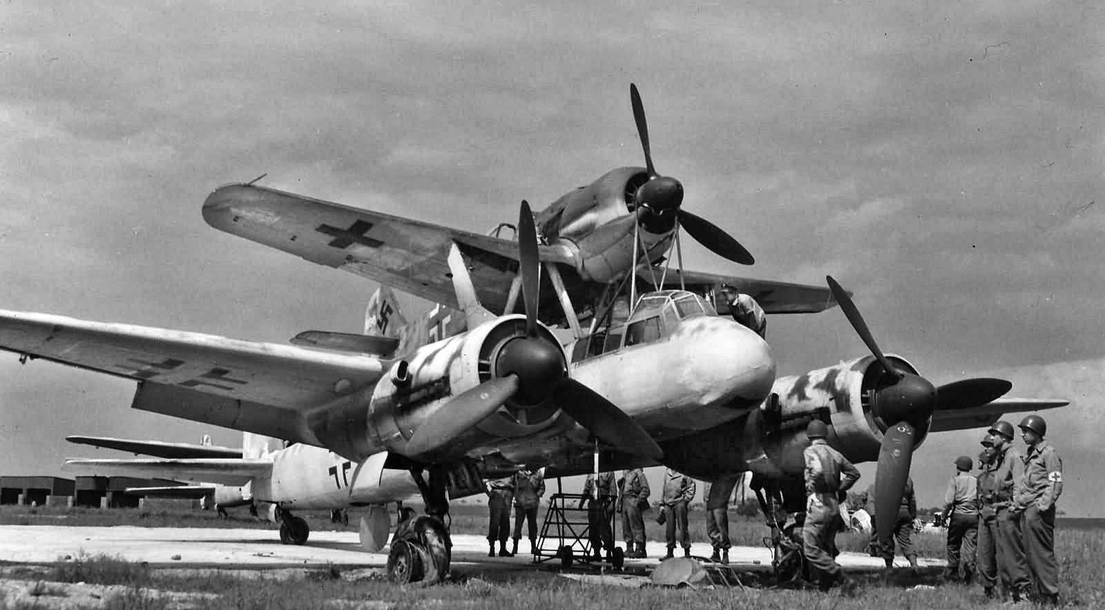 The Mistel composite aircraft consisted of an Fw-190 fighter attached to a Junkers Ju-88 bomber.  U.S. soldiers inspect this captured example at an airbase in Bernberg, Germany, in the spring of 1945.