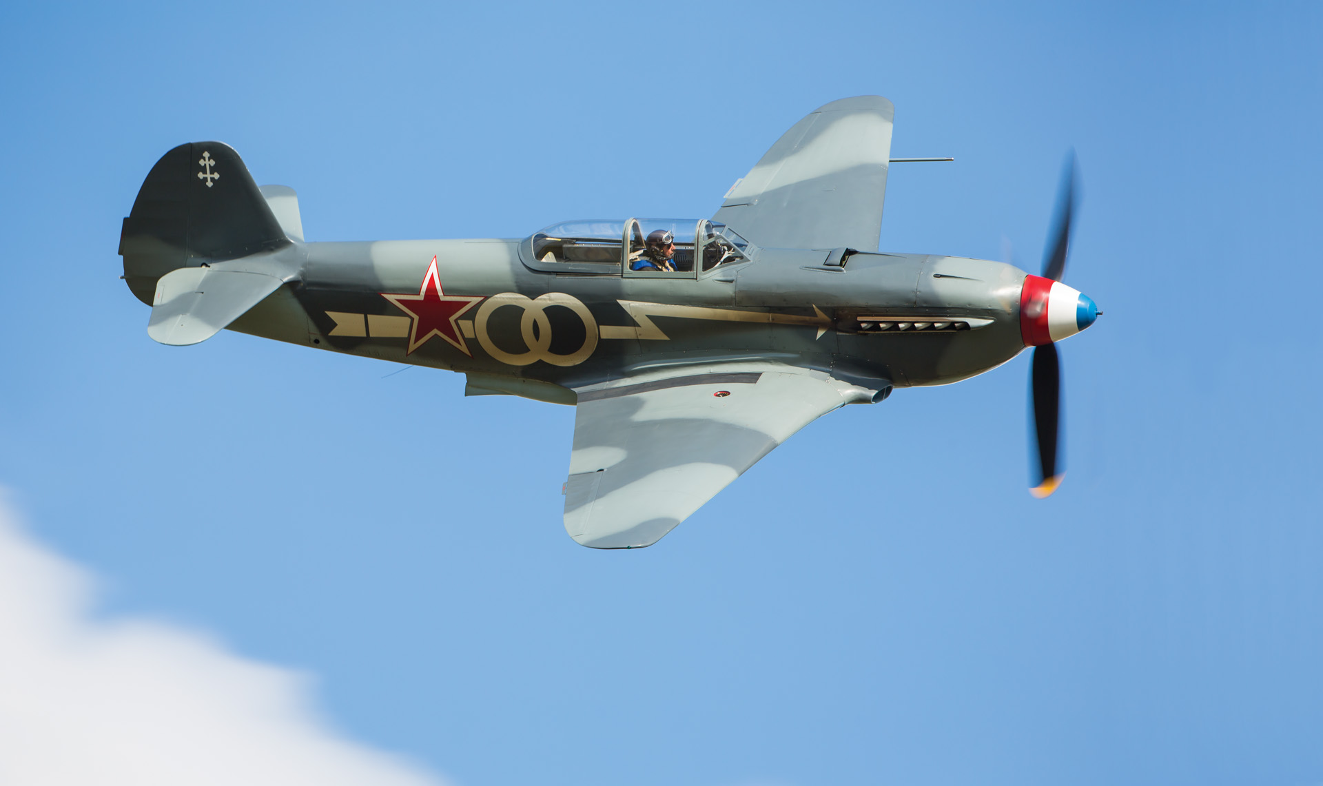 This reproduction Soviet Yakovlev Yak-3 fighter aircraft is painted in the colors of the Normandie Niemen and is an accurate representation of the type piloted by Roger Sauvage.