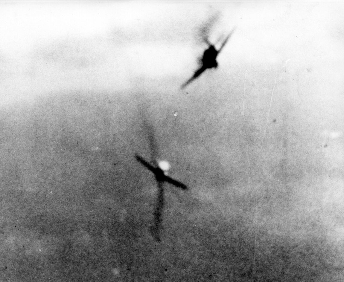A Hellcat rakes a Japanese Zero with fire from its six .50-caliber air-cooled machine guns. 