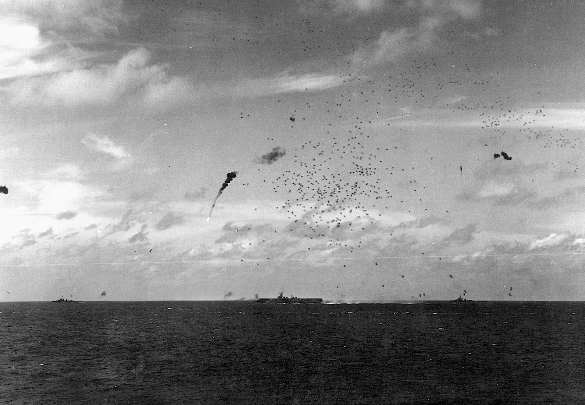 A Japanese aircraft plunges toward the sea after being struck by antiaircraft fire from a U.S. escort carrier.