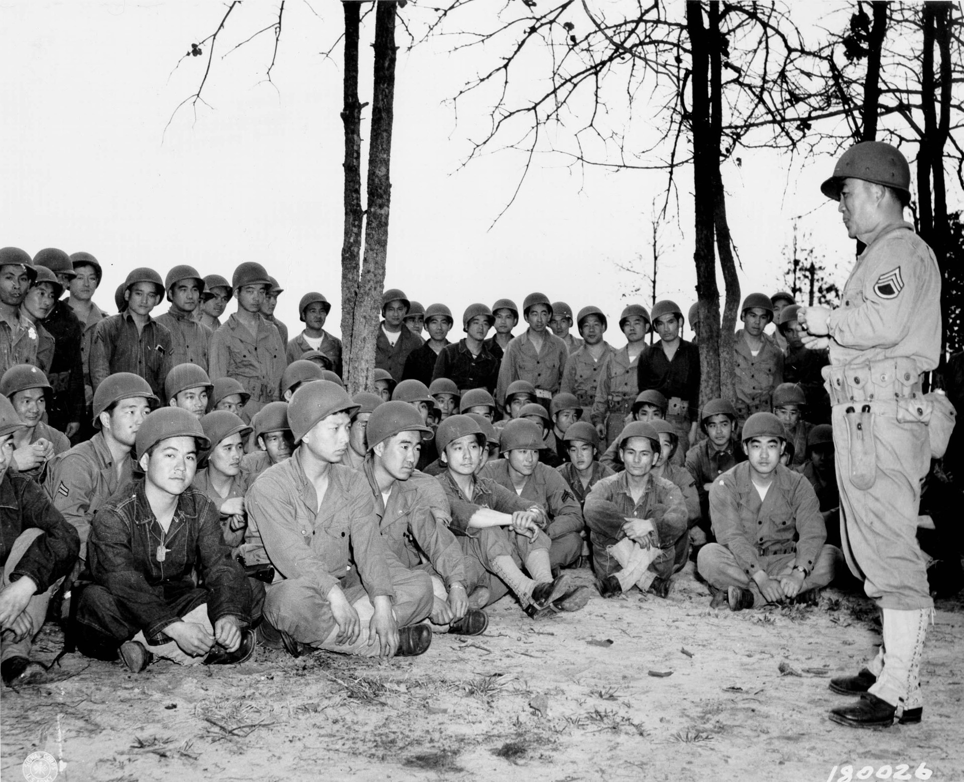 Sergeant Harry Mijamoto conducts hand-grenade training for 100th Infantry Battalion soldiers at Camp Shelby. Many of the men left the confinement of their forced-relocation centers to join the armed forces and prove their loyalty as American citizens.