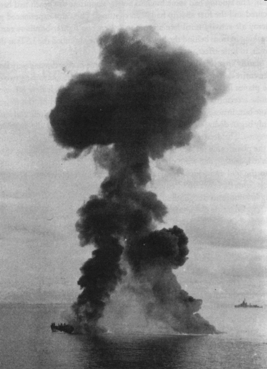 SC 699 is shown engulfed in flames off Biak Island near New Guinea immediately after being struck by a Japanese fighter aircraft. 