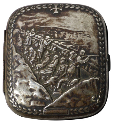 A World War I cigarette case with a battle scene. 