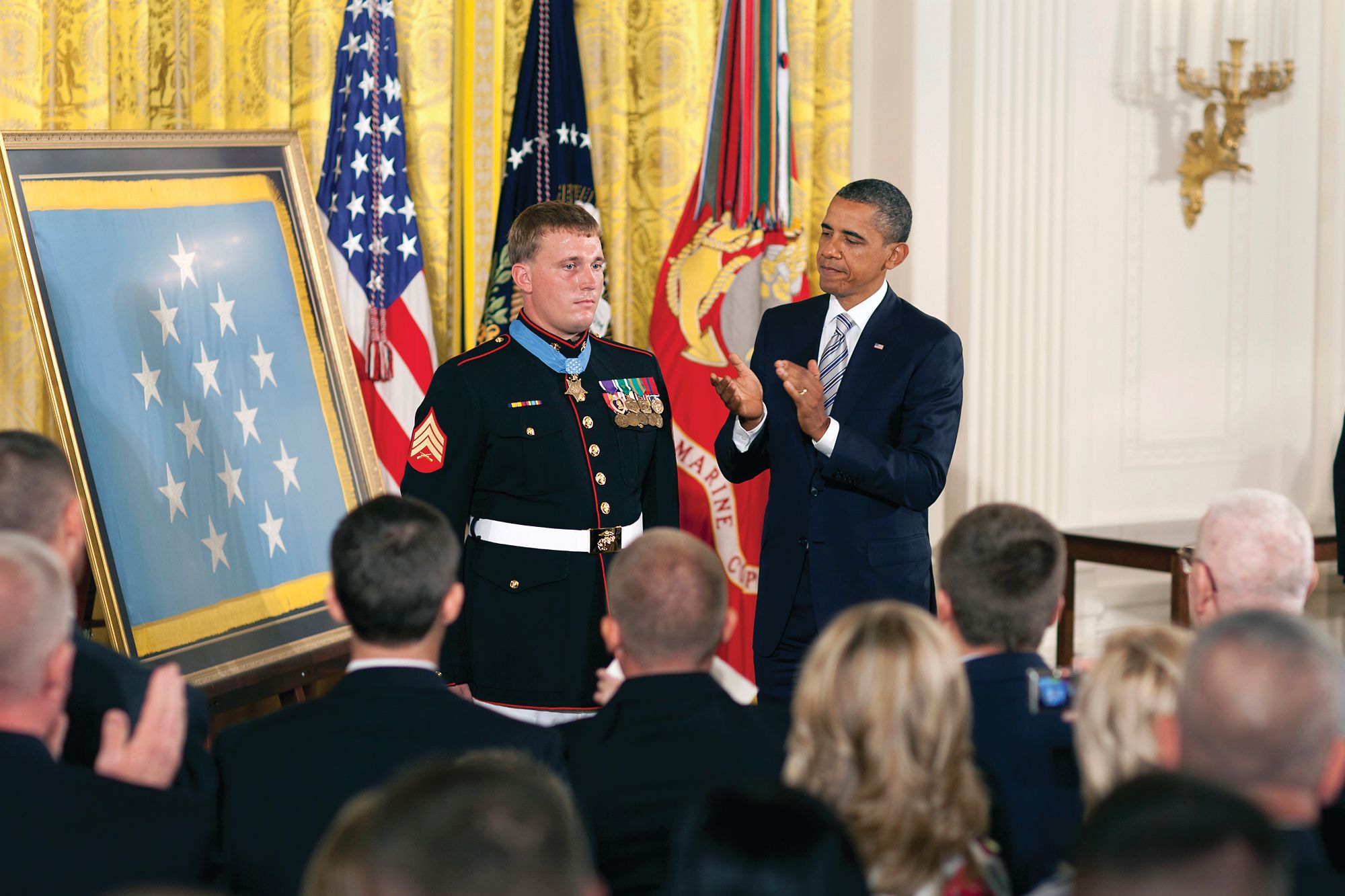 President Obama applauds Sergeant Dakota Meyer, the first living Marine recipient of the Medal of Honor for actions in Afghanistan.