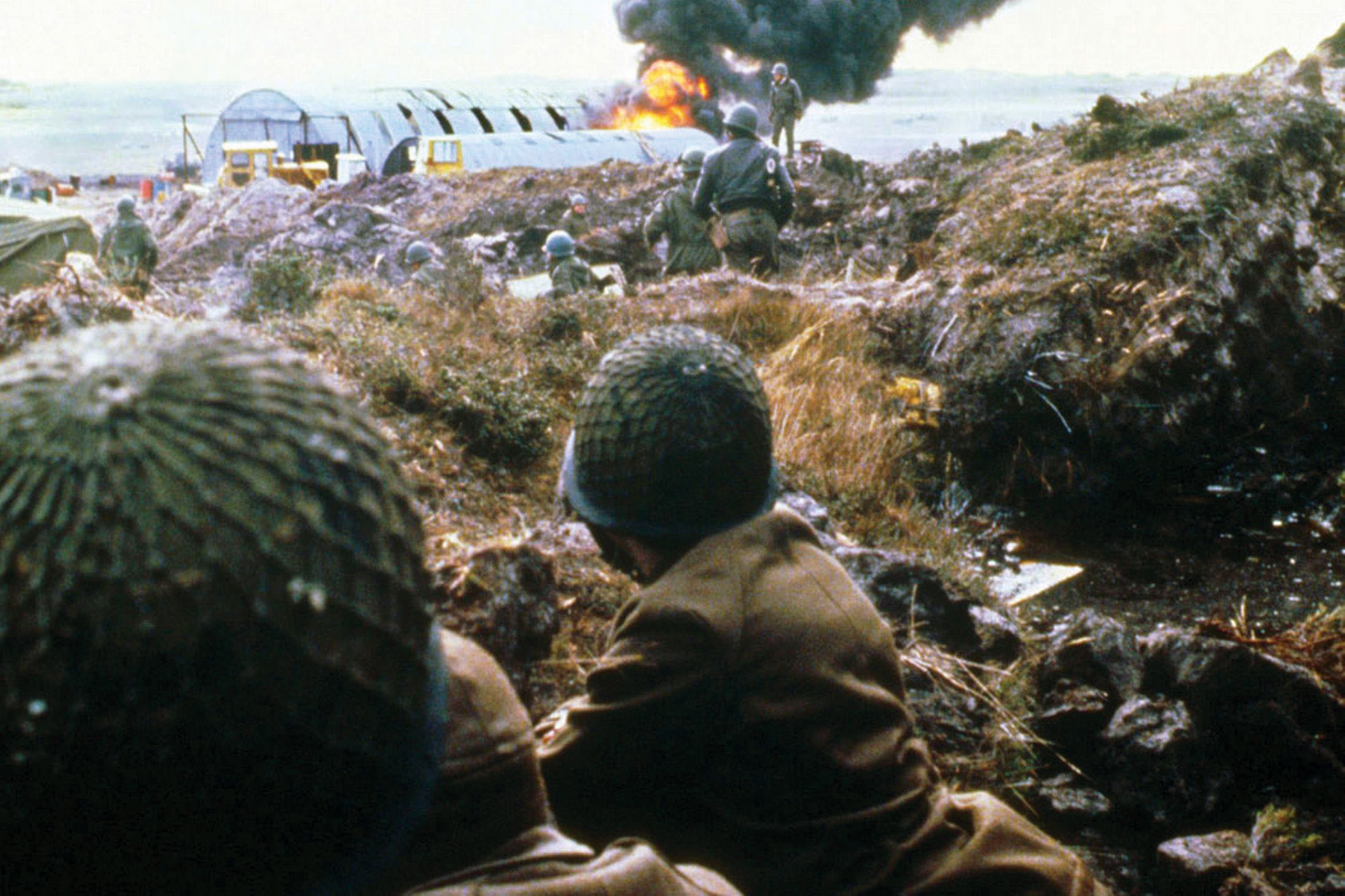 Argentine troops take cover during a Harrier strike on their position near Port Stanley. The soldiers had little luck against the Harriers with Russian-made SAM-7 shoulder-fired antiaircraft missiles. 