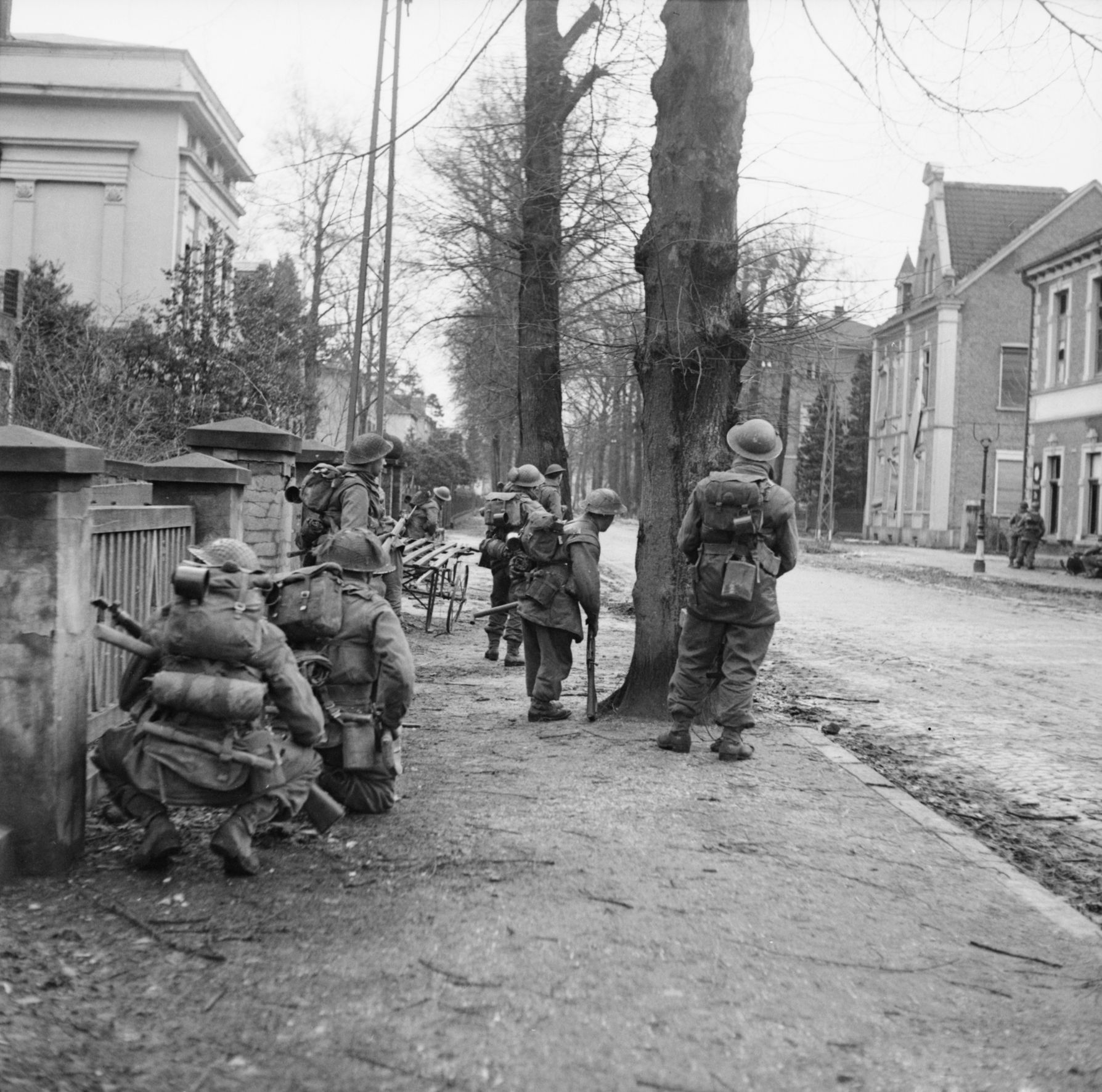 Clearing German snipers and rearguard positions was hazardous duty for these men of the British 2nd Gordon Highlanders advancing through Cleve on February 11, 1945. 