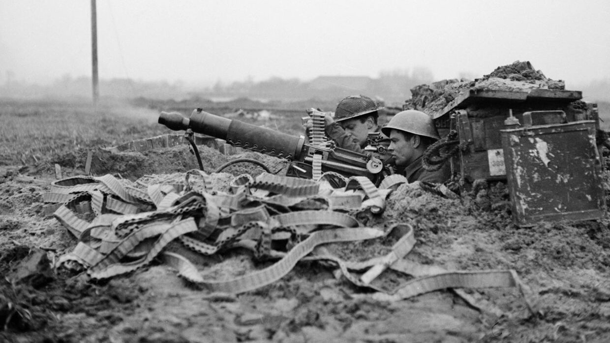 During bitter fighting for control of the town of Goch on February 20, 1945, soldiers of the 1st Middlesex Regiment man their Vickers machine gun in support of forward elements of their unit engaging German defenders.